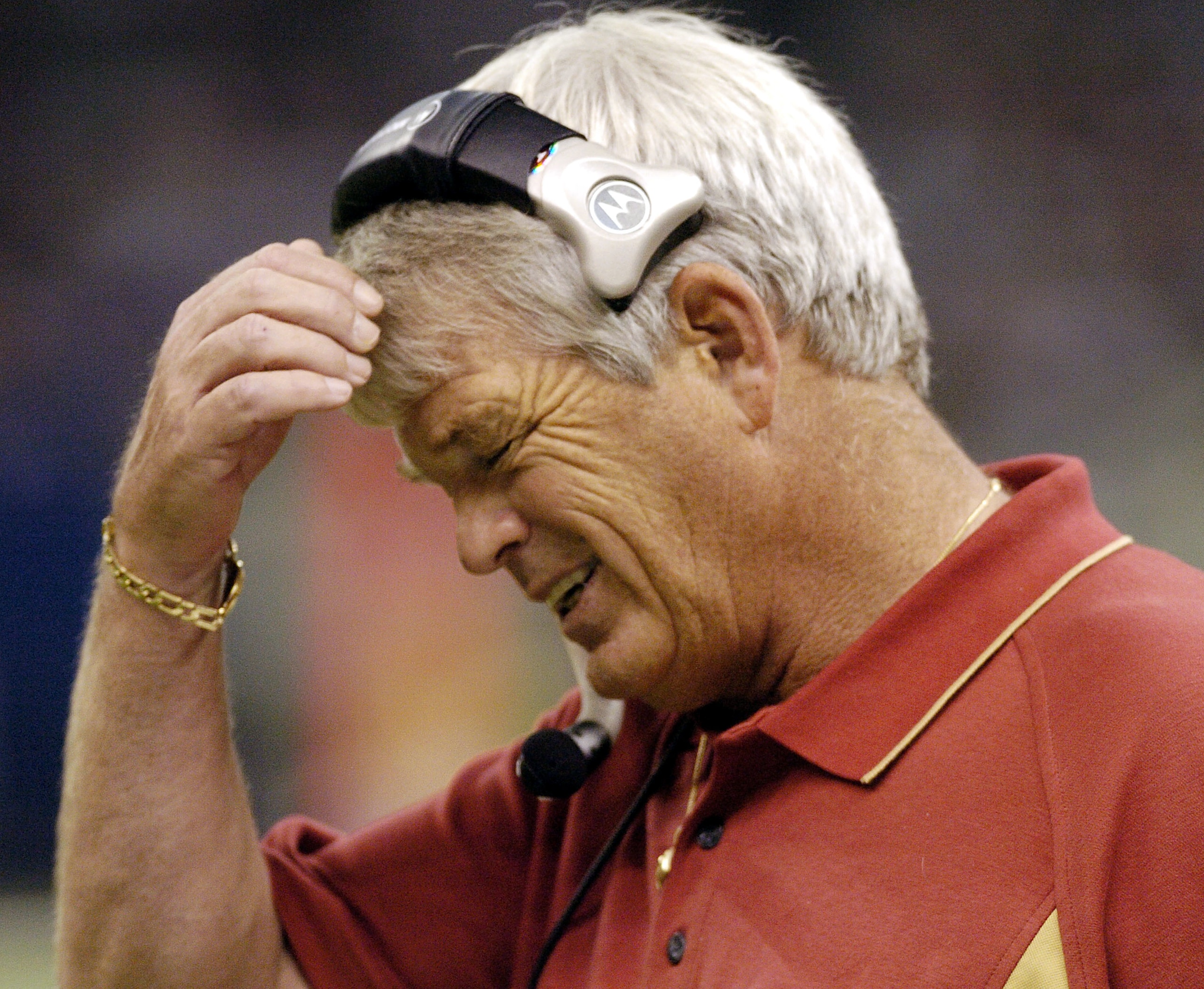 NEW ORLEANS - SEPTEMBER 19:  Head coach Dennis Erickson of the San Francisco 49ers talks on his headset while playing the New Orleans Saints on September 19, 2004 at the Louisiana Superdome in New Orleans, Louisiana.  (Photo by Chris Graythen/Getty Images