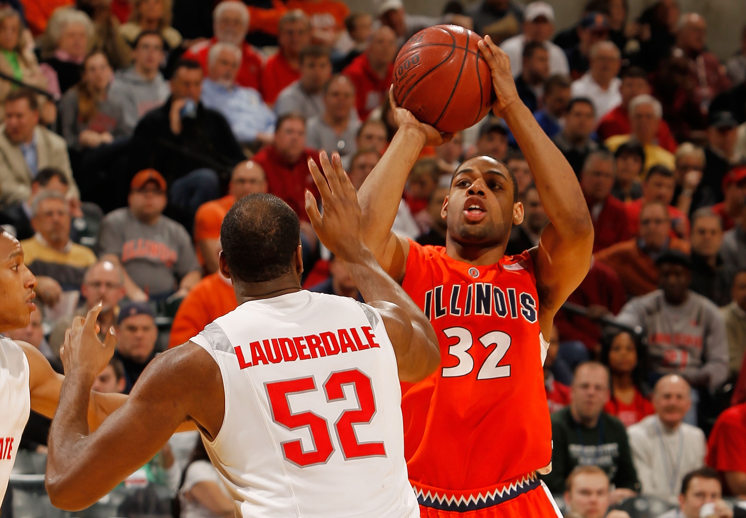 INDIANAPOLIS - MARCH 13:  Guard Demetri McCamey #32 of the Illinois Fighting Illini attempts a shot against forward Dallas Lauderdale #52 of the Ohio State Buckeyes in the semifinals of the Big Ten Men's Basketball Tournament at Conseco Fieldhouse on Marc