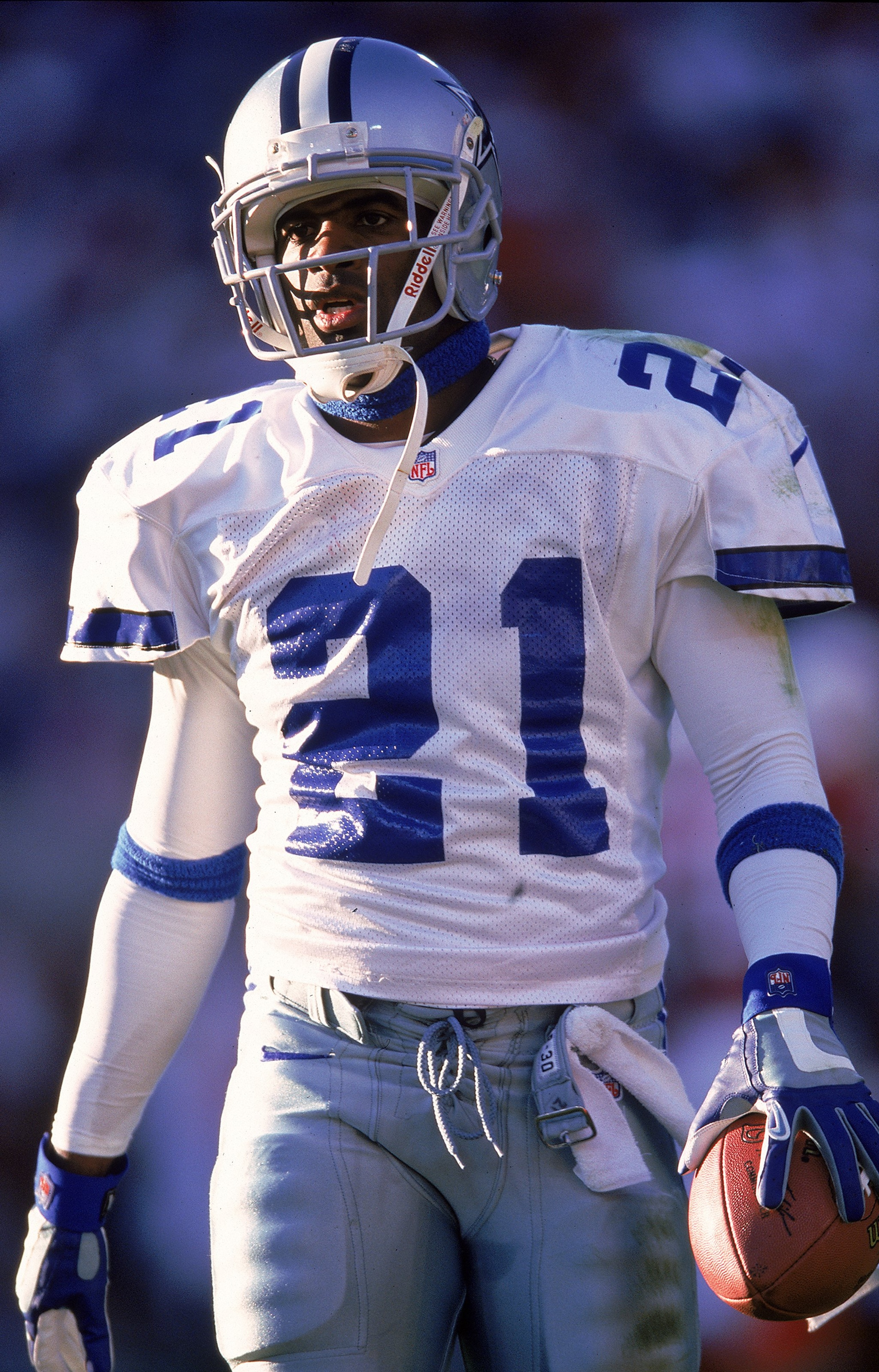 21 Nov 1999: Deion Sanders #21 of the Dallas Cowboys grips the ball as he walks on the field during the game against the Arizona Cardinals at the Sun Devil Stadium in Tempe, Arizona. The Cardinals defeated the Cowboys 9-13. Mandatory Credit: Otto Greule J