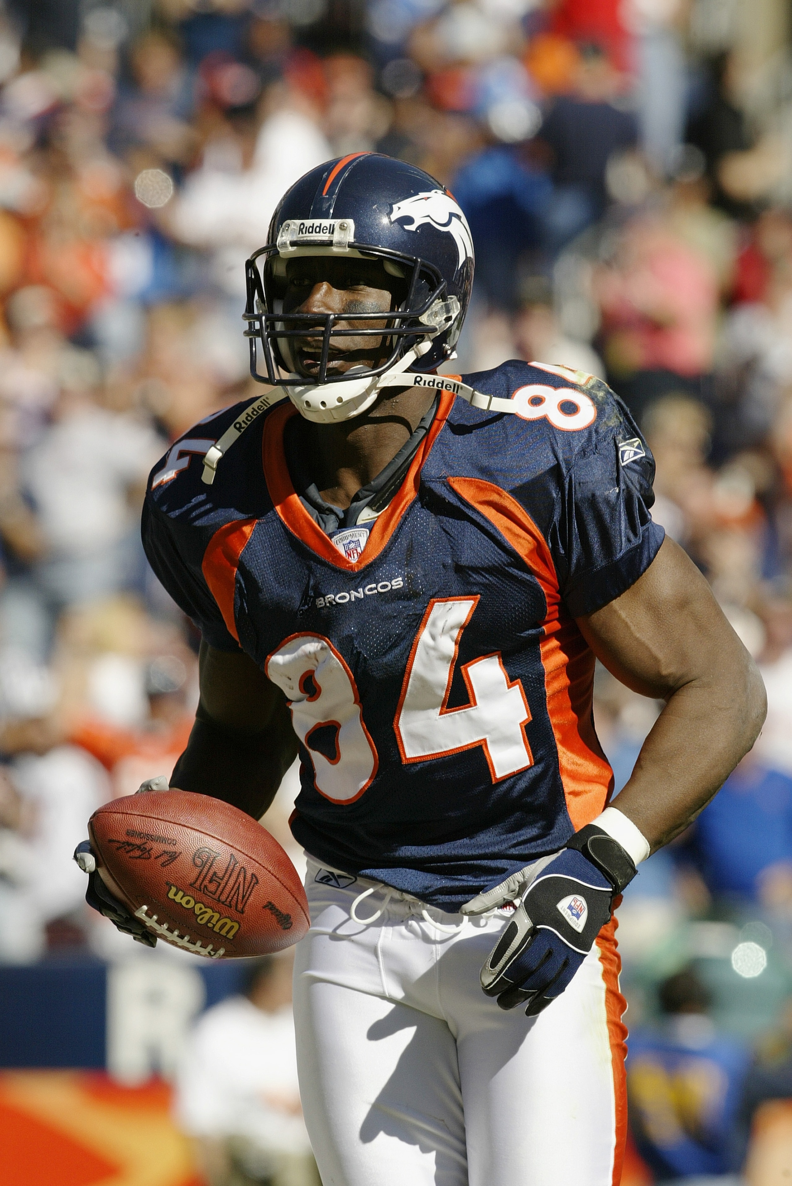 DENVER - SEPTEMBER 28:  Shannon Sharpe #84 of the Denver Broncos holds the ball after the play against the Detroit Lions on September 28, 2003 at Invesco Field at Mile High in Denver, Colorado.  The Broncos defeated the Lions 20-16.  (Photo by Brian Bahr/