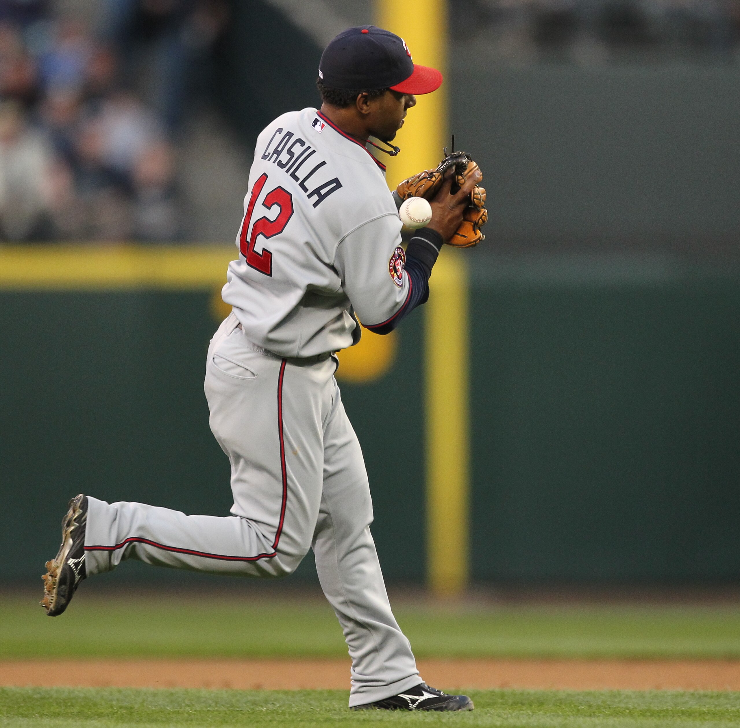 SEATTLE - AUGUST 27: Shortstop Alexi Casilla #12 of the Minnesota Twins bobbles an infield single by Adam Moore of the Seattle Mariners at Safeco Field on August 27, 2010 in Seattle, Washington. The Twins won 6-3. (Photo by Otto Greule Jr/Getty Images) SEATTLE - AUGUST 27: Shortstop Alexi Casilla #12 of the Minnesota Twins bobbles an infield single by Adam Moore of the Seattle Mariners at Safeco Field on August 27, 2010 in Seattle, Washington. The Twins won 6-3. (Photo by Otto Greule Jr/Getty Images)