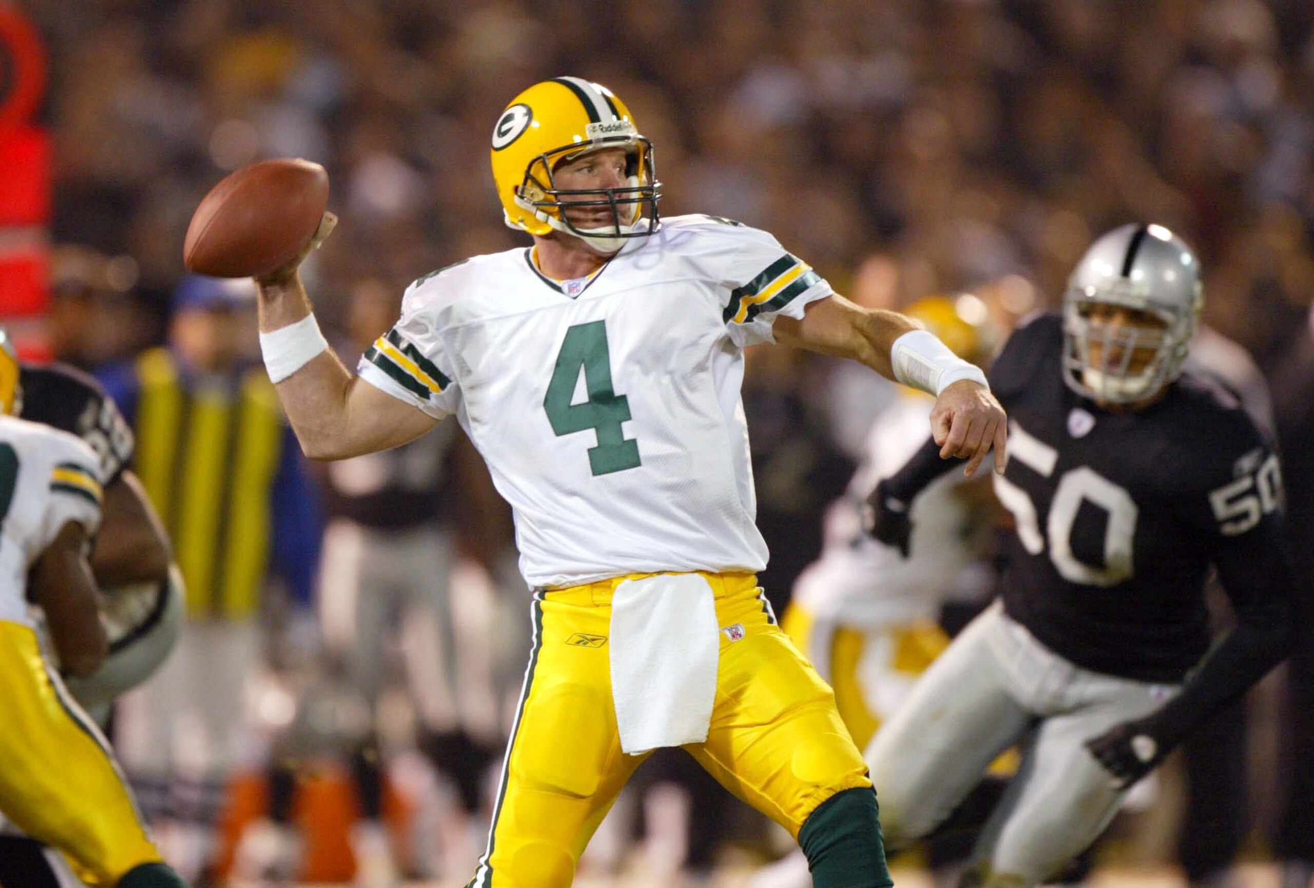 OAKLAND, CA - DECEMBER 22:  Brett Favre #4 of the Green Bay Packers passes against the Oakland Raiders December 22, 2003  at the Network Associates Coliseum in Oakland, California.  (Photo by Jed Jacobsohn/Getty Images)