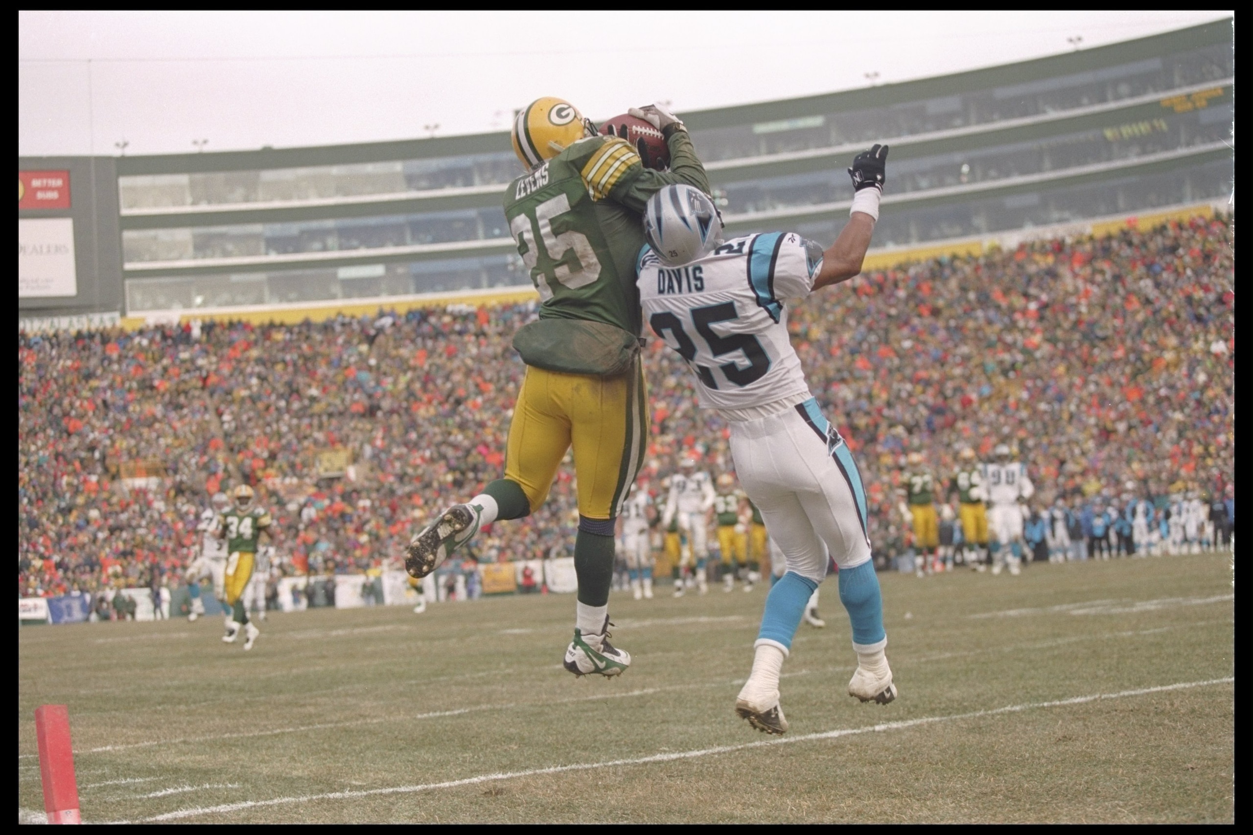 12 Jan 1997:  Running back Dorsey Levens (left) of the Green Bay Packers stops defensive back Eric Davis of the Carolina Panthers during the National Conference Playoff game at Lambeau Field in Green Bay, Wisconsin.  The Packers won the game, 30-13. Manda