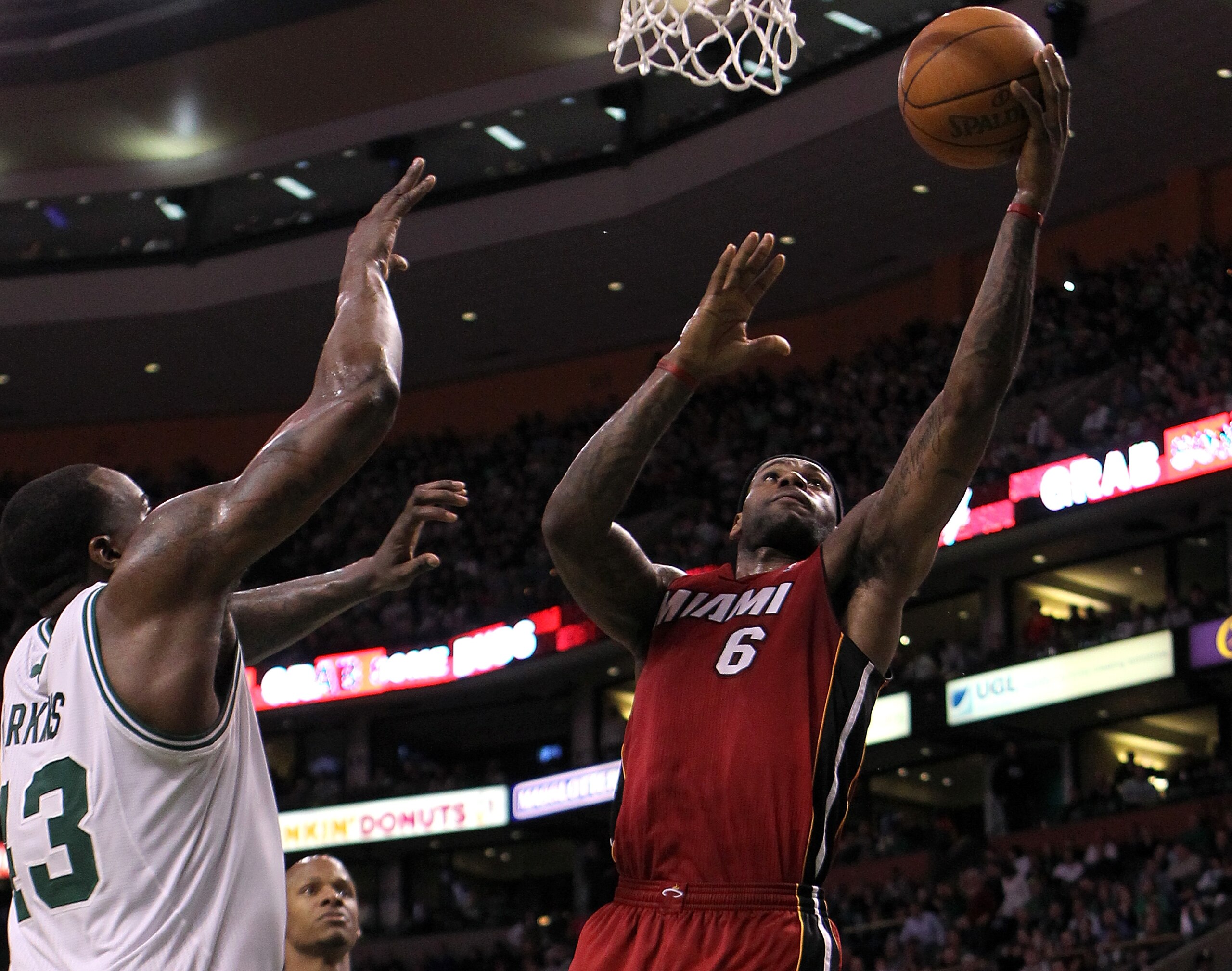 BOSTON - FEBRUARY 13:  LeBron James #6 of the Miami Heat drives  against Kendrick Perkins #43 of the Boston Celtics at TD Garden on February 13, 2011 in Boston, Massachusetts. The Cetics won 85-82. NOTE TO USER: User expressly acknowledges and agrees that