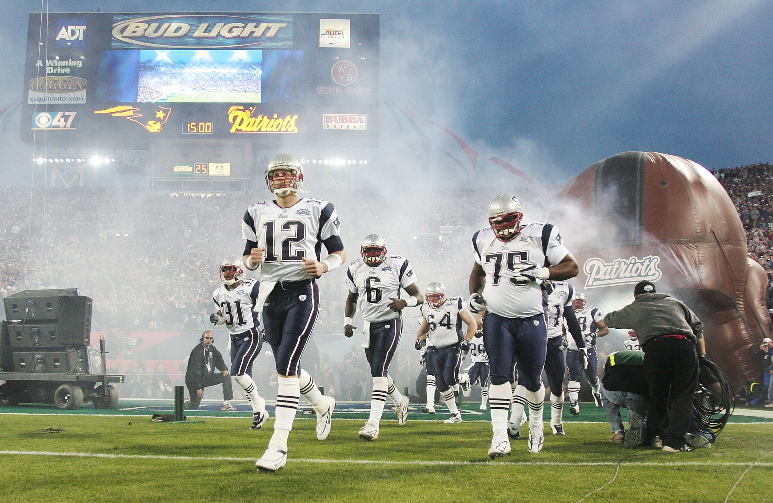 JACKSONVILLE, FLORIDA - FEBRUARY 06:  Quarterback Tom Brady #12 of the New England Patriots leads his team onto the field before the start of Super Bowl XXXIX against the Philadelphia Eagles at Alltel Stadium on February 6, 2005 in Jacksonville, Florida.