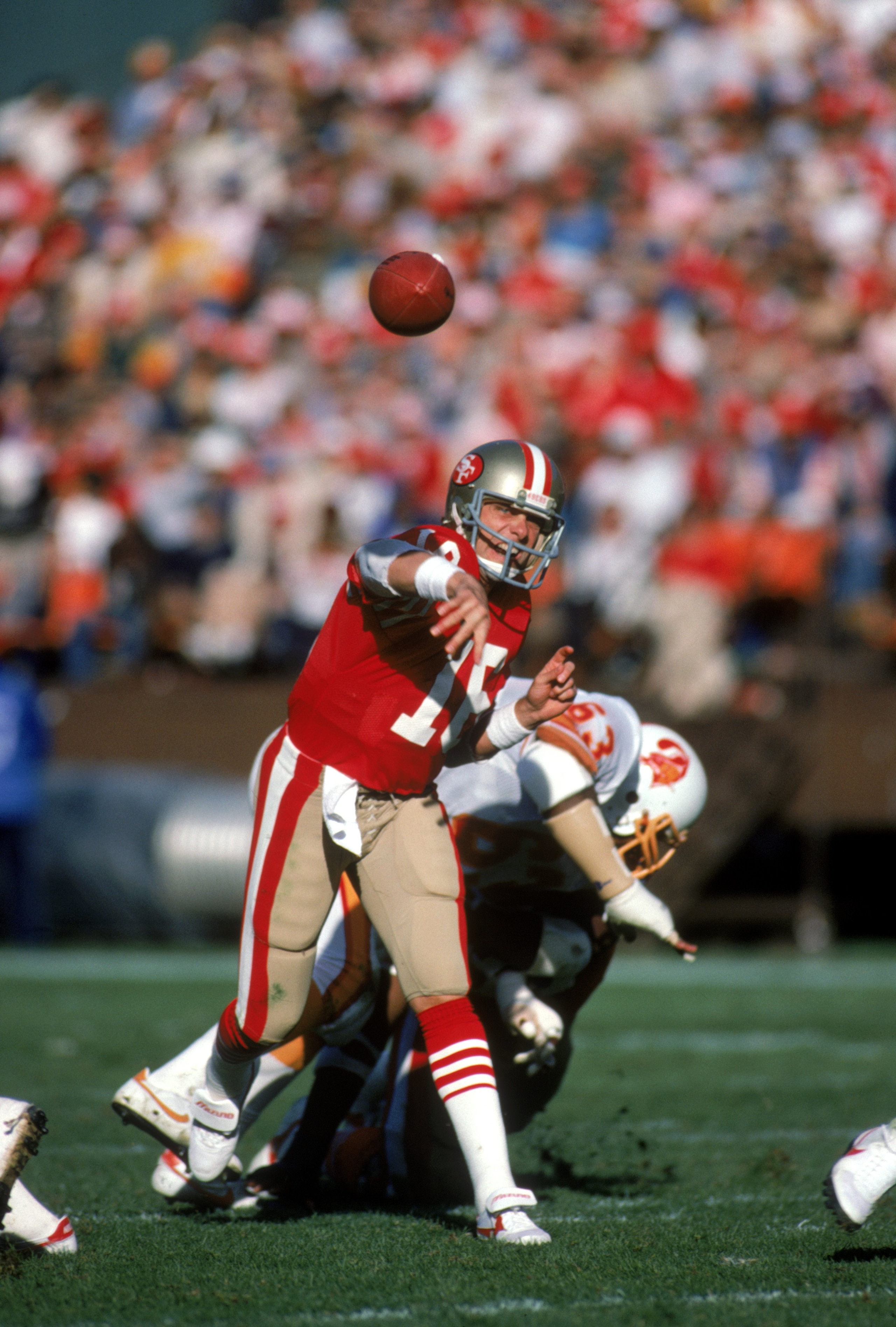 SAN FRANCISCO - NOVEMBER 18:  Quarterback Joe Montana #16 of the San Francisco 49ers throws a pass during a game against the Tampa Bay Buccaneers at Candlestick Park on November 18, 1984 in San Francisco, California.  The 49ers won 24-17.  (Photo by Georg
