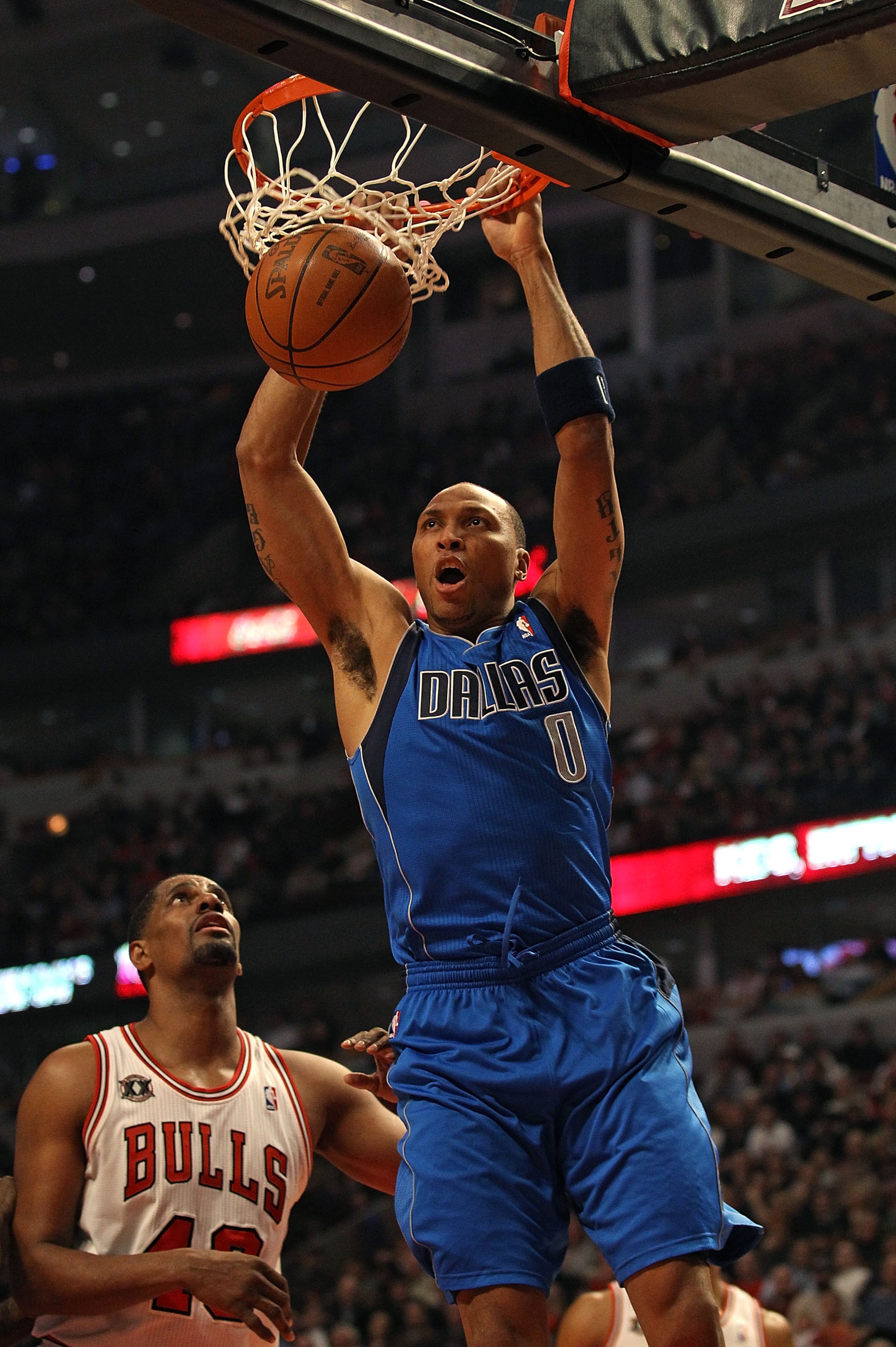 CHICAGO, IL - JANUARY 20: Shawn Marion #0 of the Dallas Mavericks dunks the ball over Kurt Thomas #40 of the Chicago Bulls at the United Center on January 20, 2011 in Chicago, Illinois. The Bulls defeated the Mavericks 82-77. NOTE TO USER: User expressly