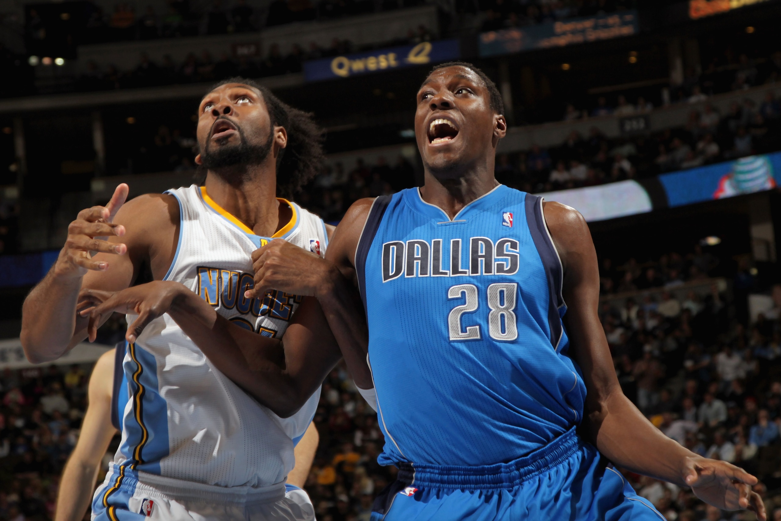 DENVER, CO - FEBRUARY 10: Nene #31 of the Denver Nuggets and Ian Mahinmi #28 of the Dallas Mavericks battle for rebounding position during NBA action at the Pepsi Center on February 10, 2011 in Denver, Colorado. The Nuggets defeated the Mavericks 121-120 DENVER, CO - FEBRUARY 10: Nene #31 of the Denver Nuggets and Ian Mahinmi #28 of the Dallas Mavericks battle for rebounding position during NBA action at the Pepsi Center on February 10, 2011 in Denver, Colorado. The Nuggets defeated the Mavericks 121-120