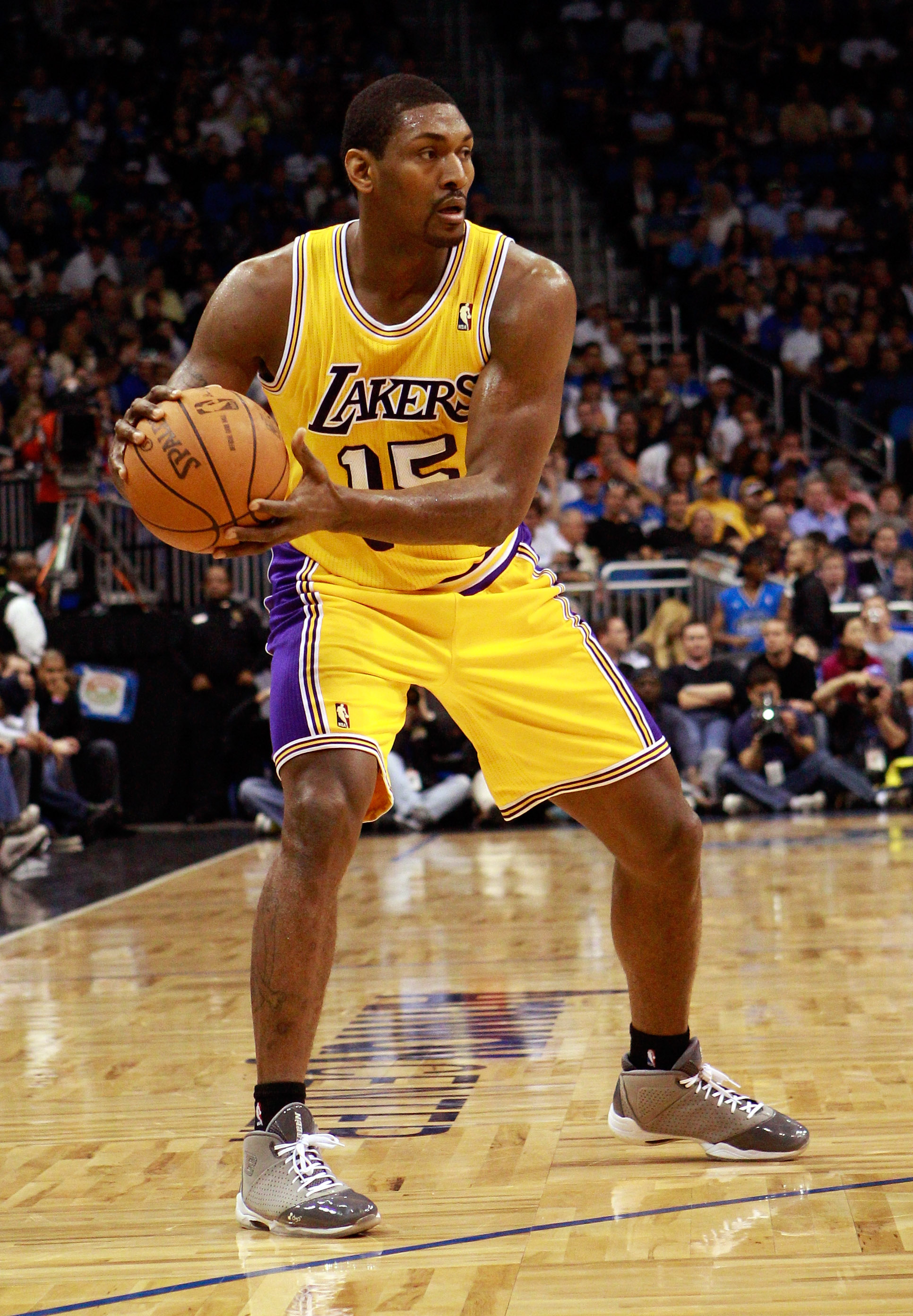 ORLANDO, FL - FEBRUARY 13:  Ron Artest #15 of the Los Angels Lakers looks to pass during the game against the Orlando Magic at Amway Arena on February 13, 2011 in Orlando, Florida.  NOTE TO USER: User expressly acknowledges and agrees that, by downloading
