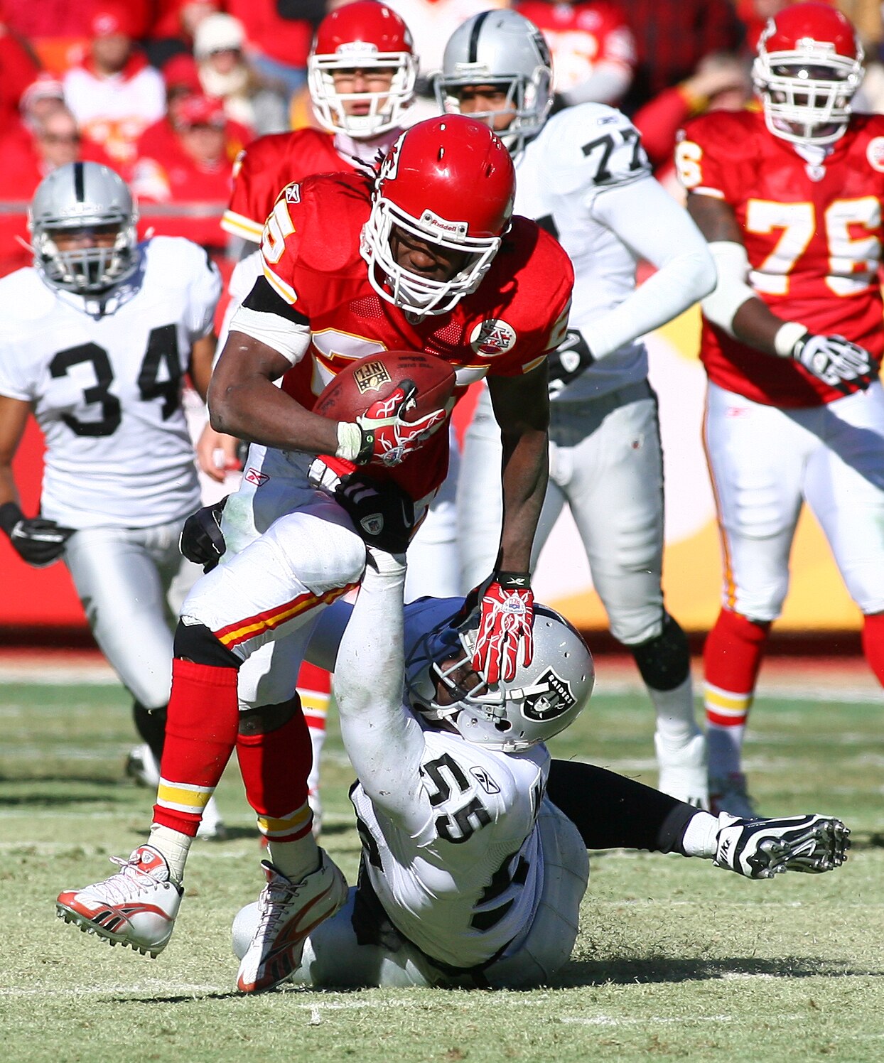 KANSAS CITY, MO - JANUARY 02:  Running back Jamaal Charles #25 of the Kansas City Chiefs is tackled by linebacker Rolando McClain #55 of the Oakland Raiders in a game at Arrowhead Stadium on January 2, 2011 in Kansas City, Missouri.  (Photo by Tim Umphrey