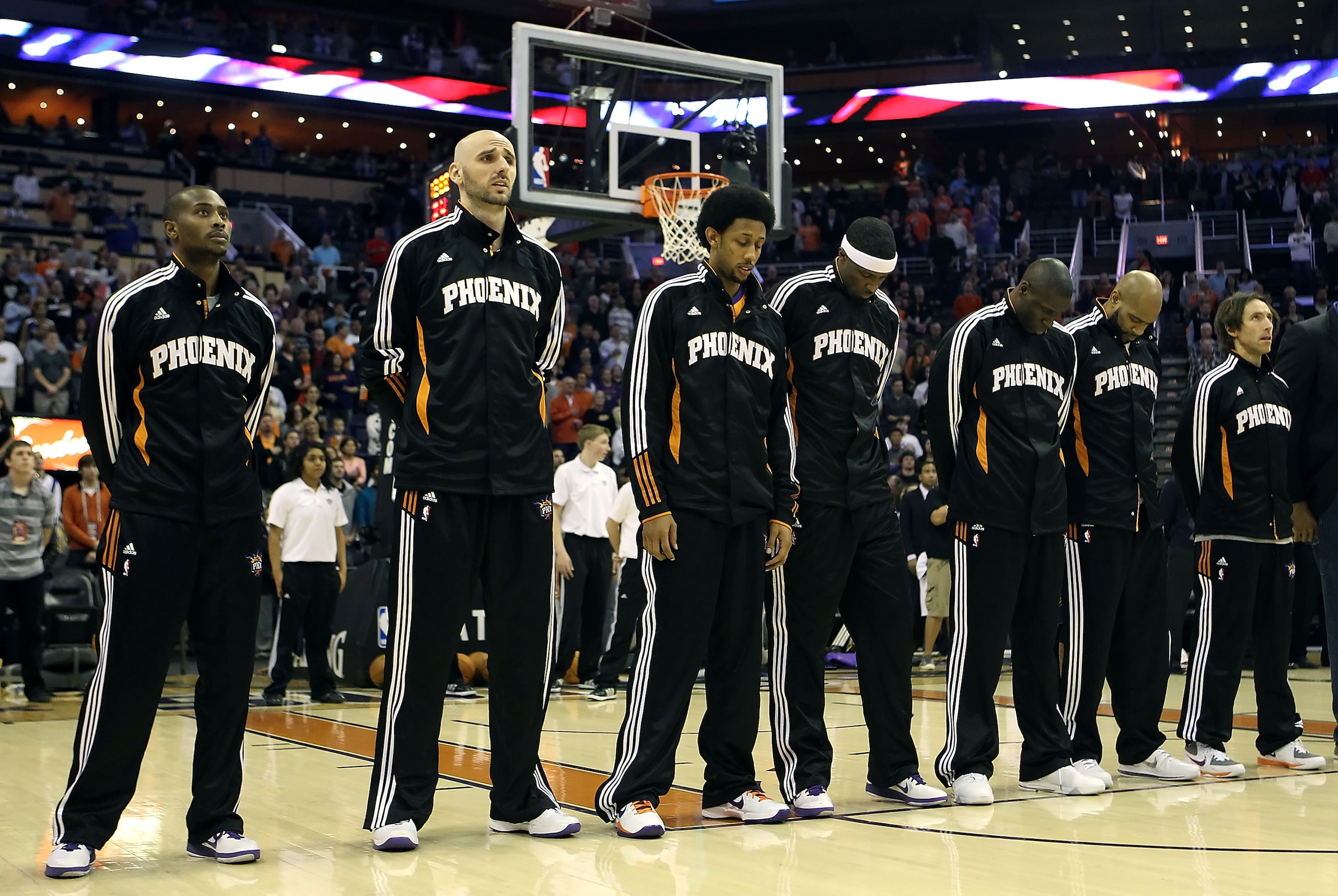 PHOENIX, AZ - JANUARY 14:  The Phoenix Suns stand attended for the National Anthem before the NBA game against the Portland Trail Blazers at US Airways Center on January 14, 2011 in Phoenix, Arizona. The Suns defeated the Trail Blazers 115-111. NOTE TO US