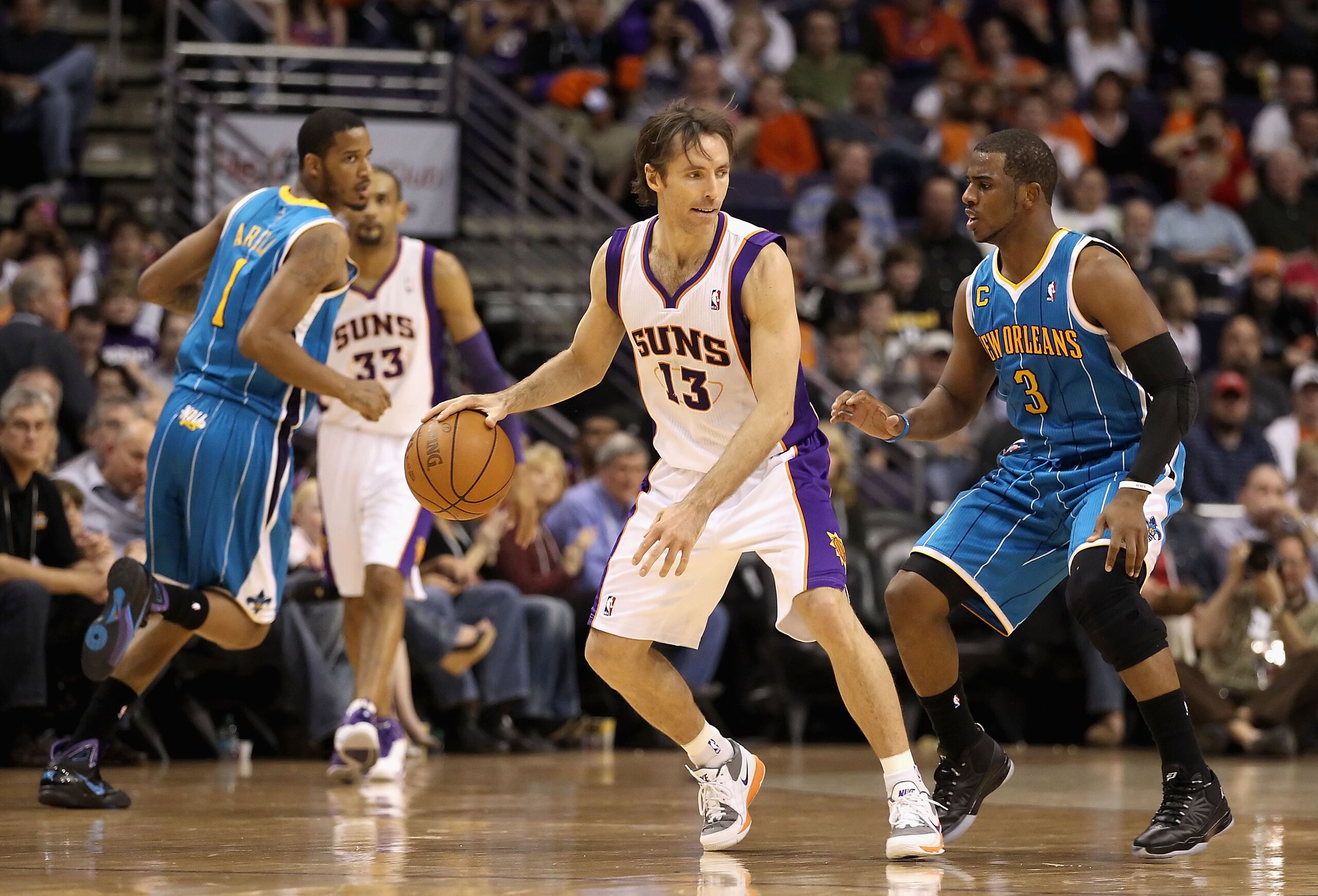 PHOENIX, AZ - JANUARY 30: Steve Nash #13 of the Phoenix Suns handles the ball during the NBA game against the New Orleans Hornets at US Airways Center on January 30, 2011 in Phoenix, Arizona. The Suns defeated the Hornets 104-102. NOTE TO USER: User exp PHOENIX, AZ - JANUARY 30: Steve Nash #13 of the Phoenix Suns handles the ball during the NBA game against the New Orleans Hornets at US Airways Center on January 30, 2011 in Phoenix, Arizona. The Suns defeated the Hornets 104-102. NOTE TO USER: User exp