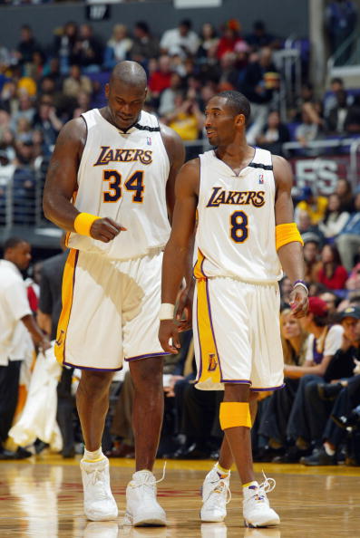 LOS ANGELES - DECEMBER 29:  Shaquille O'Neal #34 and Kobe Bryant #8 of the Los Angeles Lakers walk back on the court after a time out against the Toronto Raptors  during the game at Staples Center on December 29, 2002 in Los Angeles, California.  The Lake