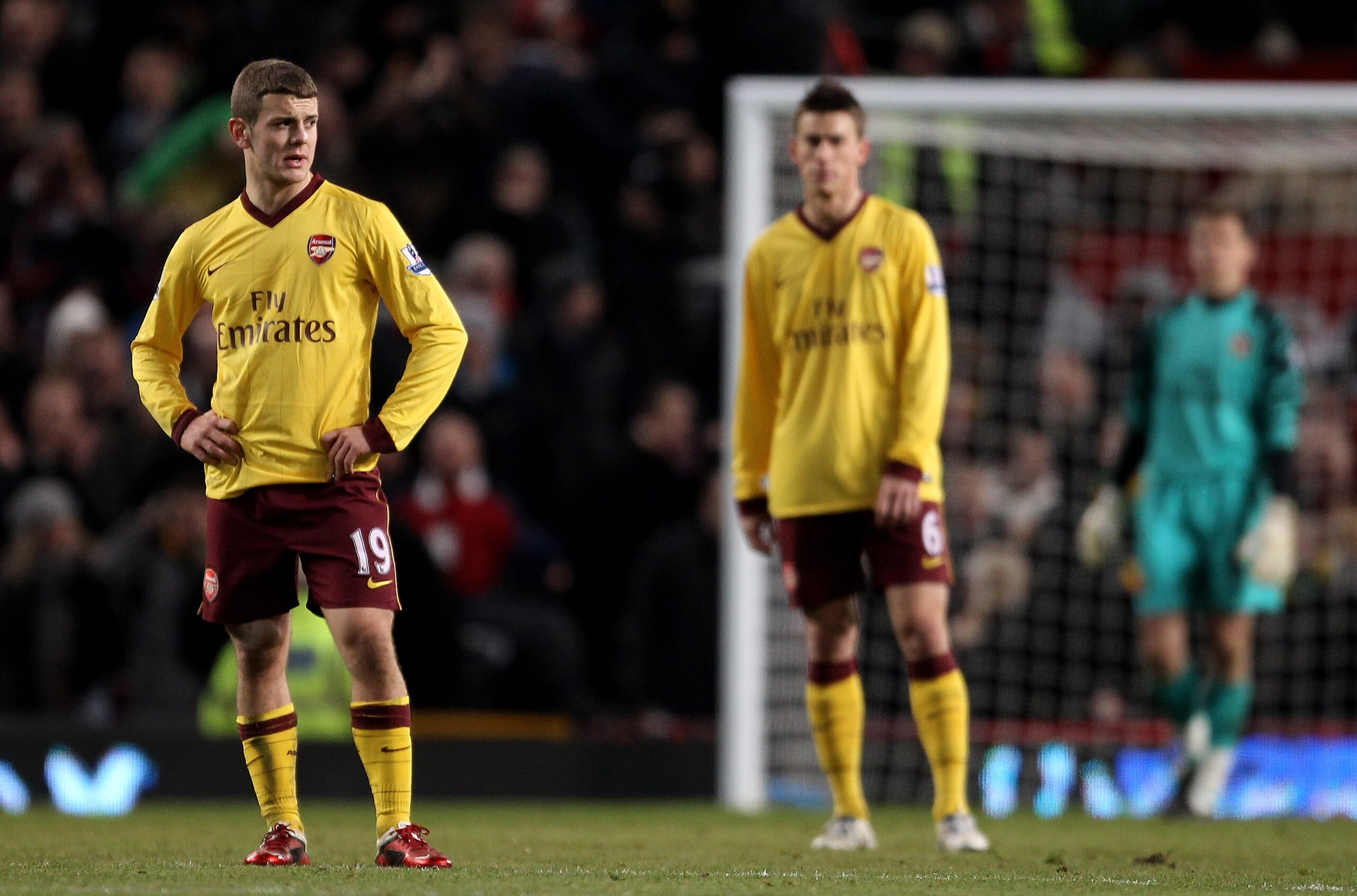 MANCHESTER, ENGLAND - DECEMBER 13:  Jack Wilshere (L) of Arsenal and his team mates look on after conceding the opening goal during the Barclays Premier League match between Manchester United and Arsenal at Old Trafford on December 13, 2010 in Manchester,