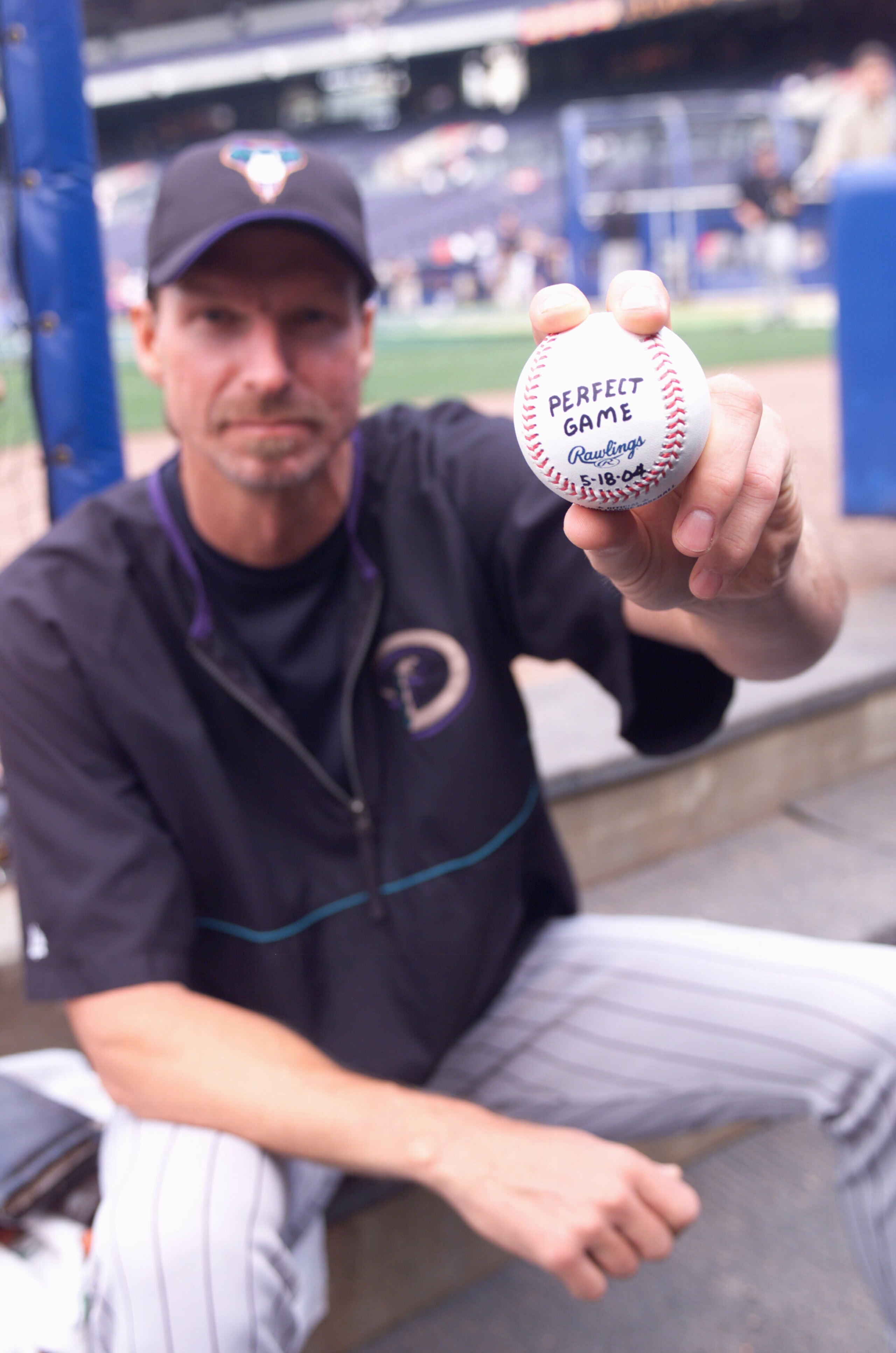 ATLANTA - MAY 19: Randy Johnson of the Arizona Diamondbacks poses with a ball on May 19, 2004 at Turner Field in Atlanta, Georgia. The ball is commemorating his perfect game against the Atlanta Braves on May 18. (Photo by Scott Cunningham/Getty Images) ATLANTA - MAY 19: Randy Johnson of the Arizona Diamondbacks poses with a ball on May 19, 2004 at Turner Field in Atlanta, Georgia. The ball is commemorating his perfect game against the Atlanta Braves on May 18. (Photo by Scott Cunningham/Getty Images)