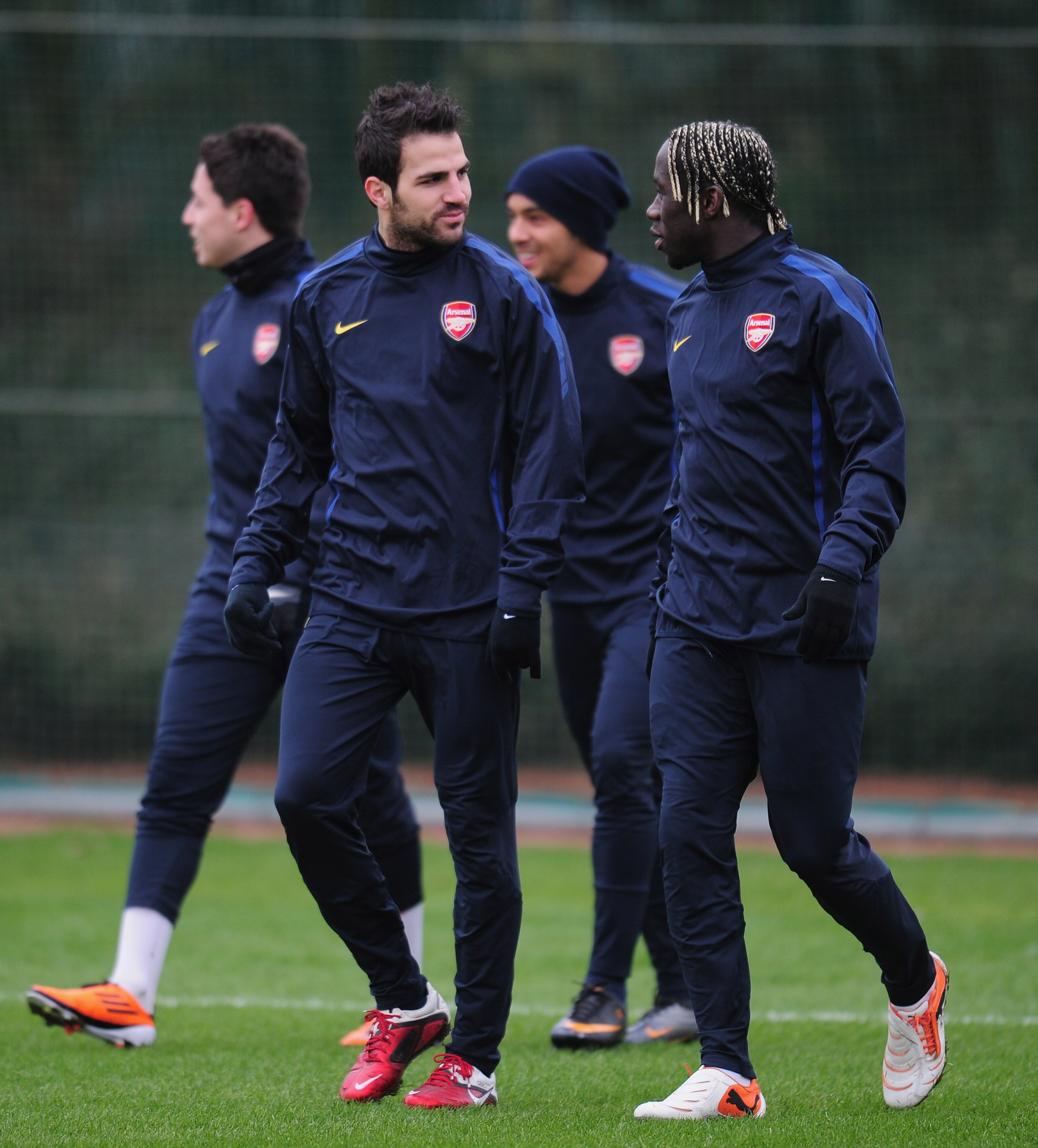 ST ALBANS, ENGLAND - FEBRUARY 15:  Cesc Fabregas and Bacary Sagna of Arsenal warm-up during training at London Colney on February 15, 2011 in St Albans, England.  (Photo by Shaun Botterill/Getty Images)