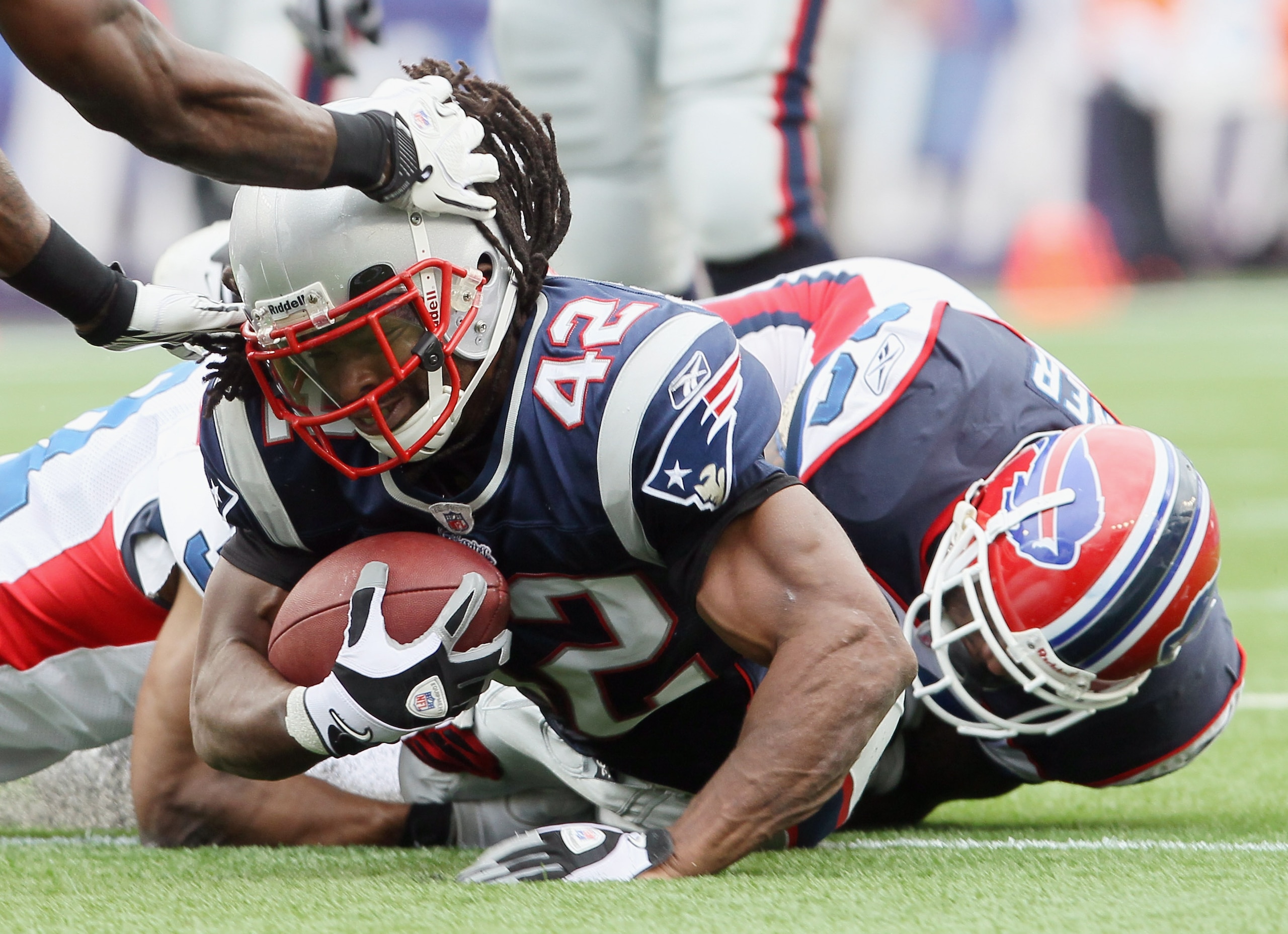 FOXBORO, MA - SEPTEMBER 26: BenJarvus Green-Ellis #42 of the New England Patriots is brought down by Donte Whitner #20 of the Buffalo Bills during on September 26, 2010 at Gillette Stadium in Foxboro, Massachusetts. The Patriots defeated the Bills 38-30. FOXBORO, MA - SEPTEMBER 26: BenJarvus Green-Ellis #42 of the New England Patriots is brought down by Donte Whitner #20 of the Buffalo Bills during on September 26, 2010 at Gillette Stadium in Foxboro, Massachusetts. The Patriots defeated the Bills 38-30.