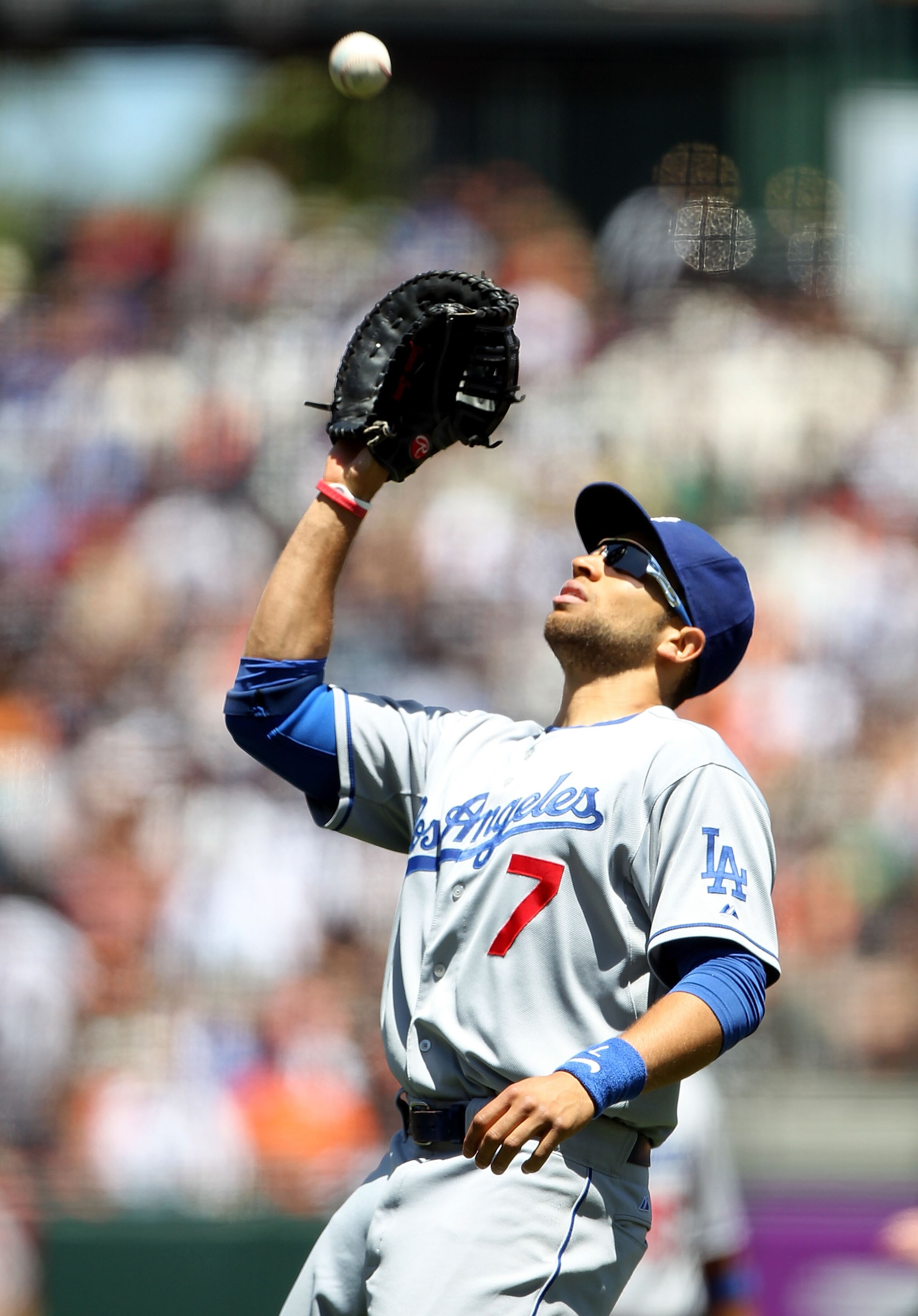 SAN FRANCISCO - JUNE 30: James Loney #7 of the Los Angeles Dodgers catches a ball hit by Pablo Sandoval of the San Francisco Giants in the fourth inning during an MLB game at AT&T Park on June 30, 2010 in San Francisco, California.  (Photo by Jed Jacobsoh