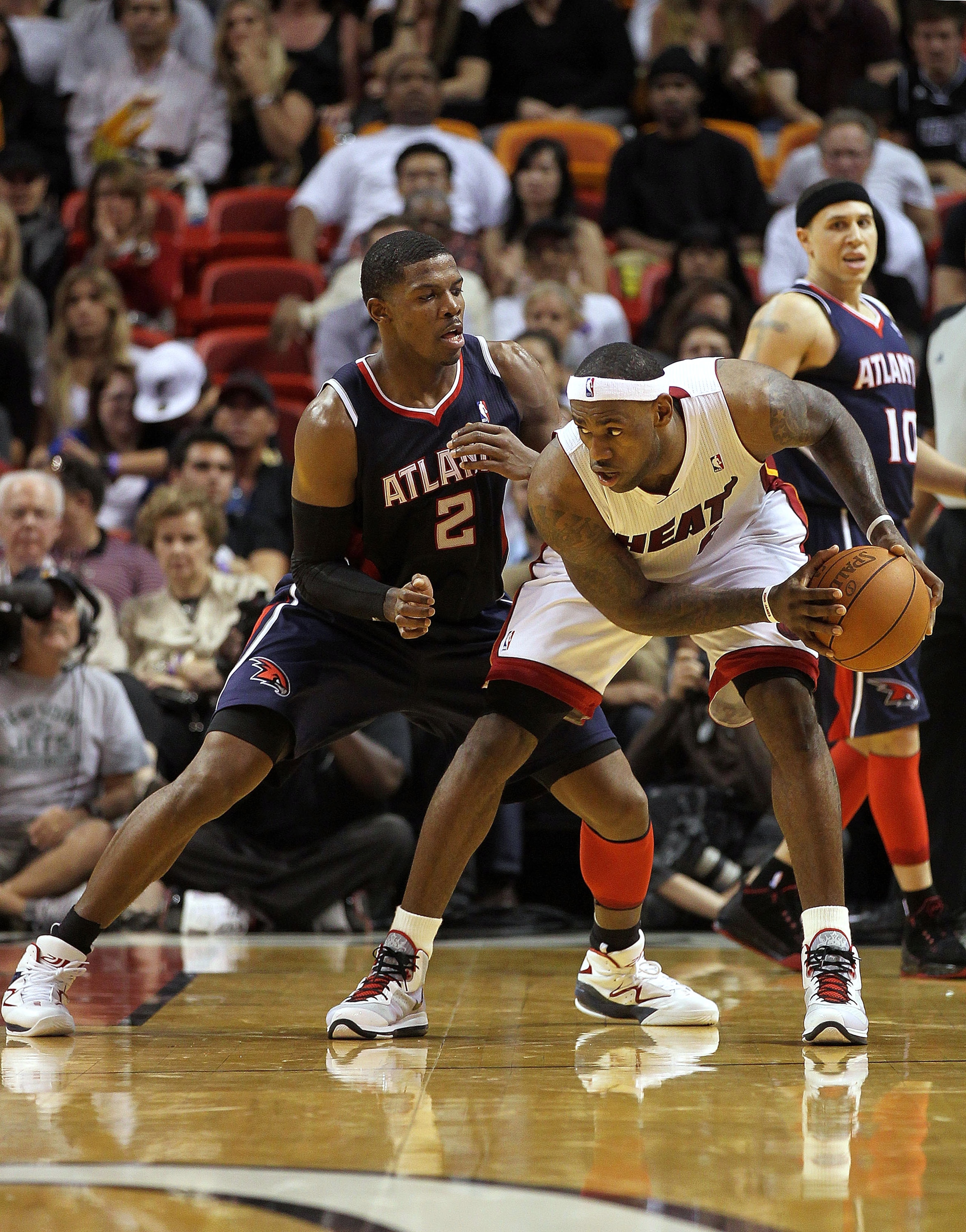 MIAMI, FL - JANUARY 18:  LeBron James #6 of the Miami Heat posts up Joe Johnson #2 of the Atlanta Hawks during a game at American Airlines Arena on January 18, 2011 in Miami, Florida. NOTE TO USER: User expressly acknowledges and agrees that, by downloadi