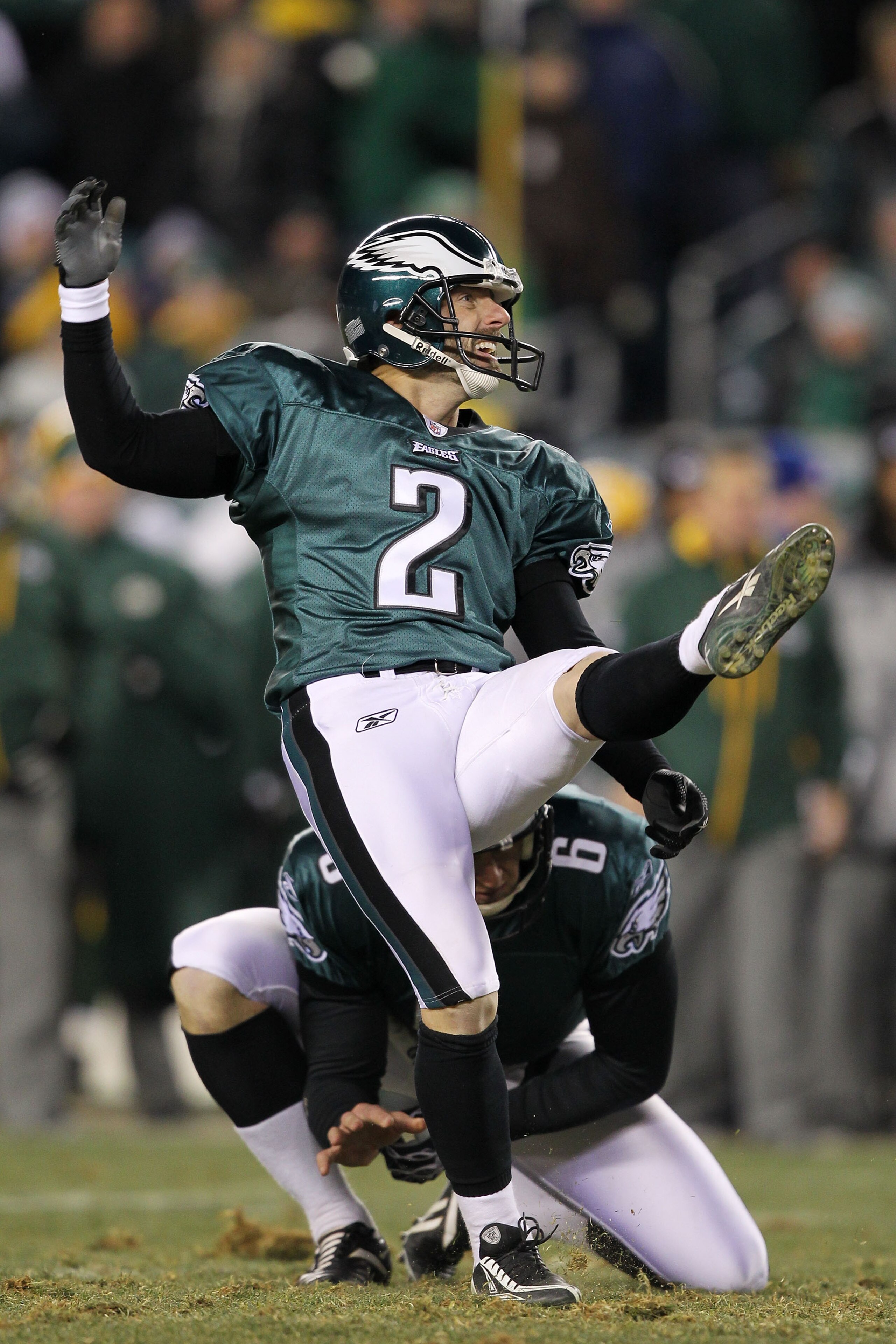 PHILADELPHIA, PA - JANUARY 09: David Akers #2 kicks as Sav Rocca #6 of the Philadelphia Eagles holds against the Green Bay Packers during the 2011 NFC wild card playoff game at Lincoln Financial Field on January 9, 2011 in Philadelphia, Pennsylvania. (P PHILADELPHIA, PA - JANUARY 09: David Akers #2 kicks as Sav Rocca #6 of the Philadelphia Eagles holds against the Green Bay Packers during the 2011 NFC wild card playoff game at Lincoln Financial Field on January 9, 2011 in Philadelphia, Pennsylvania. (P