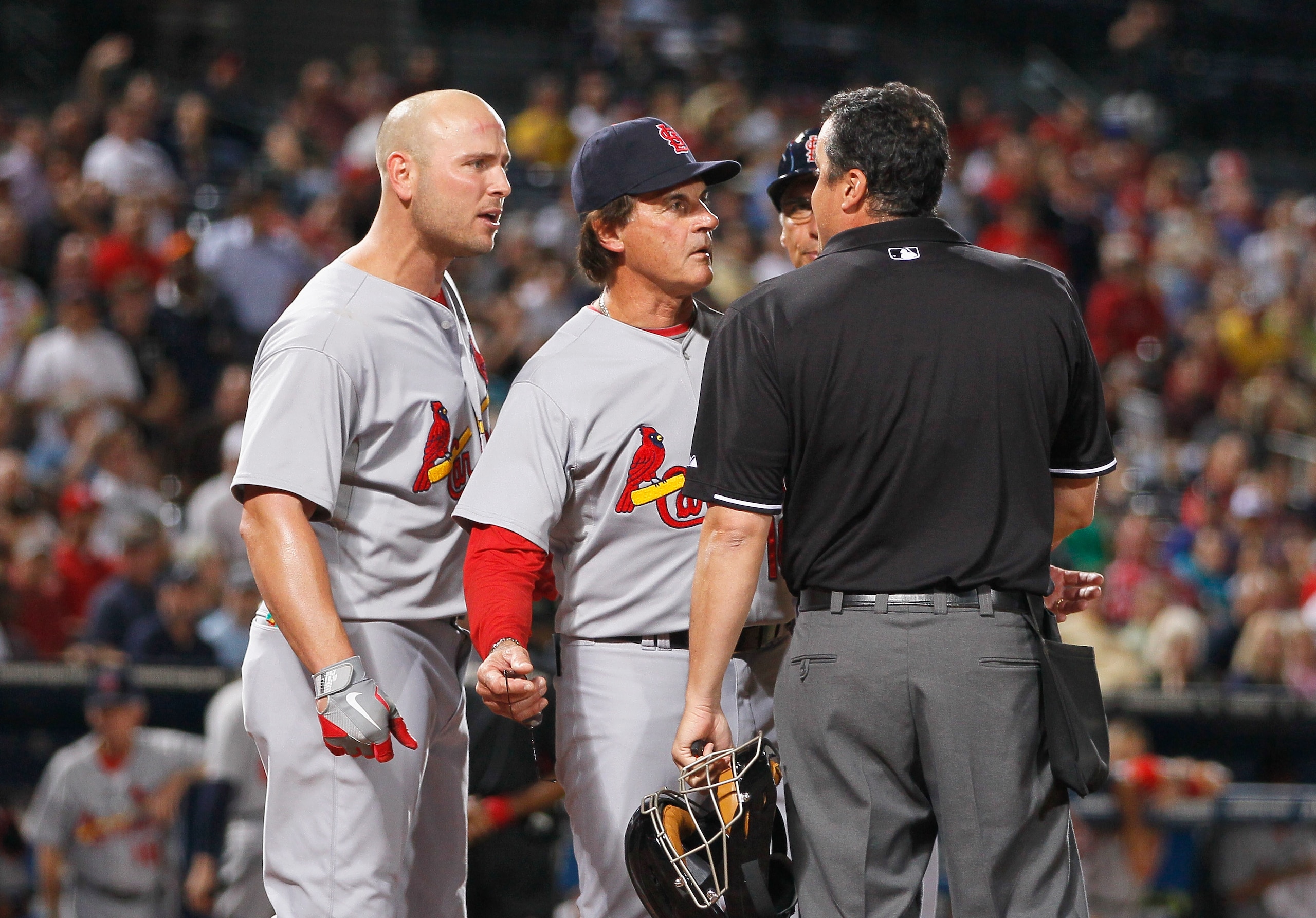 ATLANTA - SEPTEMBER 09: Homeplate umpire Mike DiMuro #16, manager Tony LaRussa and Matt Holliday #7 of the St. Louis Cardinals against the Atlanta Braves at Turner Field on September 9, 2010 in Atlanta, Georgia. (Photo by Kevin C. Cox/Getty Images) ATLANTA - SEPTEMBER 09: Homeplate umpire Mike DiMuro #16, manager Tony LaRussa and Matt Holliday #7 of the St. Louis Cardinals against the Atlanta Braves at Turner Field on September 9, 2010 in Atlanta, Georgia. (Photo by Kevin C. Cox/Getty Images)