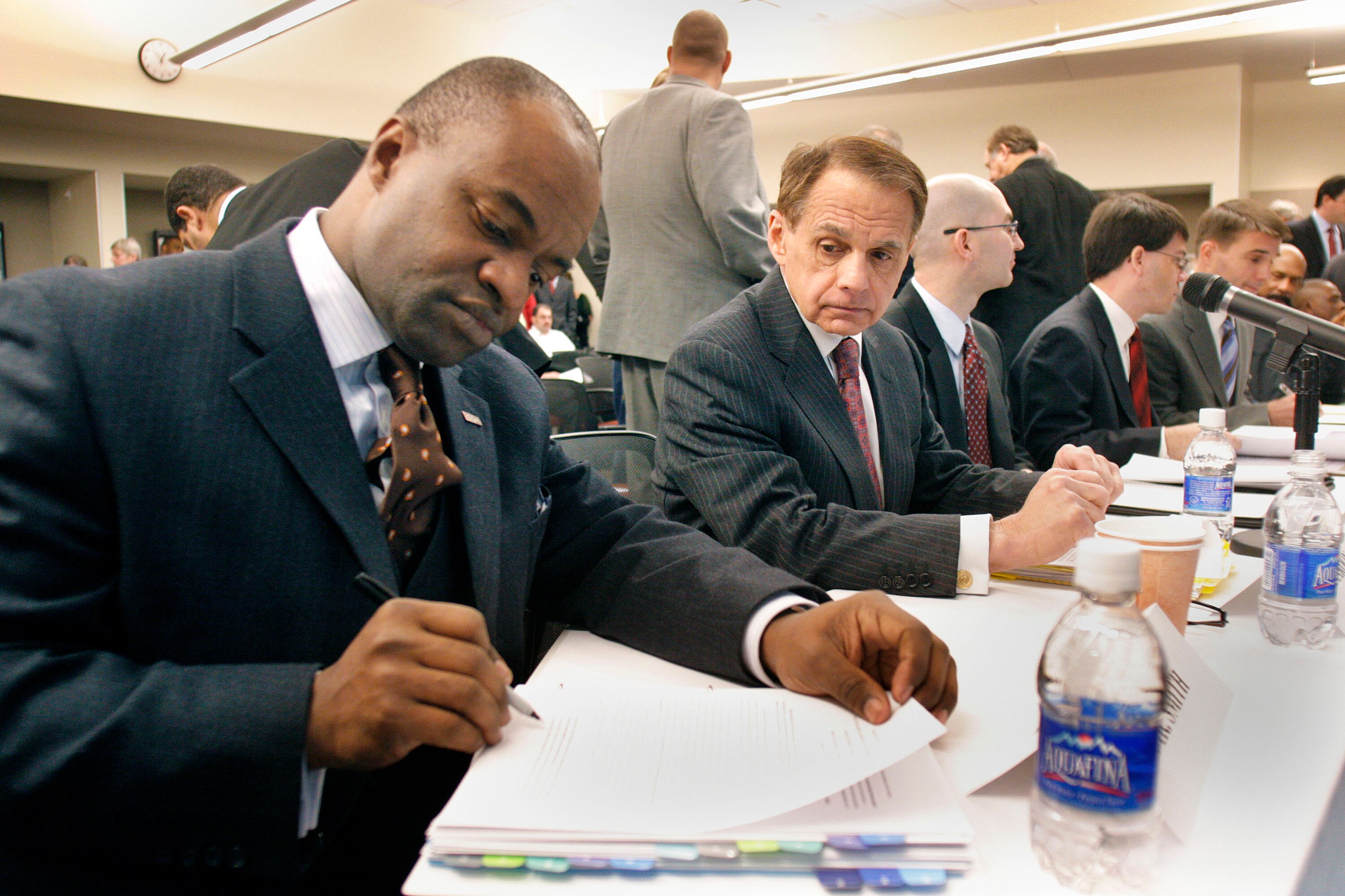 DETROIT -  JANUARY 4:  DeMaurice Smith (L) Executive Director of the NFL Players Association, prepares to speak as a witness at a U.S. House Judiciary field hearing January 4, 2010 in Detroit, Michigan. The hearing was designed to consider recent steps ta