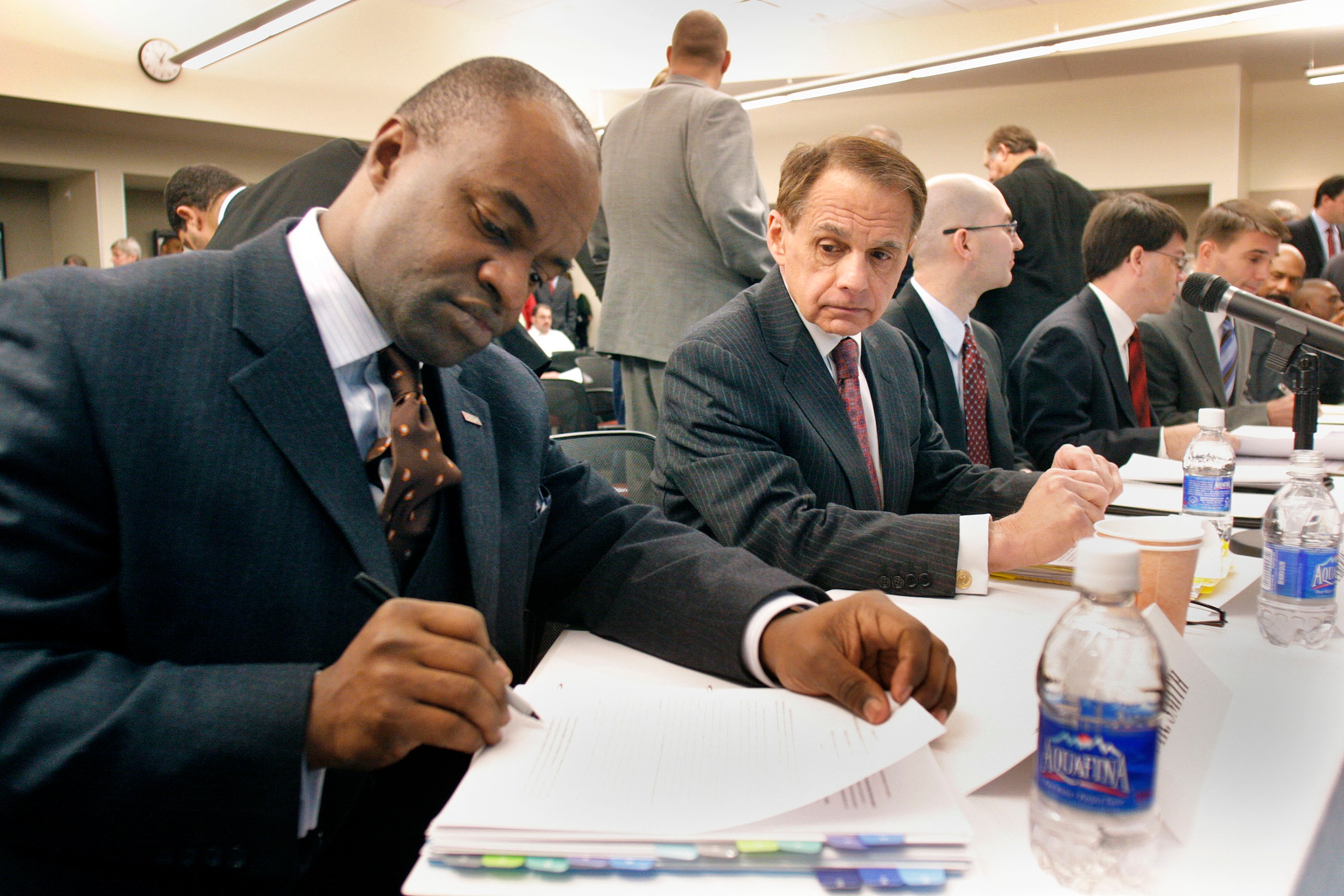 DETROIT -  JANUARY 4:  DeMaurice Smith (L) Executive Director of the NFL Players Association, prepares to speak as a witness at a U.S. House Judiciary field hearing January 4, 2010 in Detroit, Michigan. The hearing was designed to consider recent steps ta