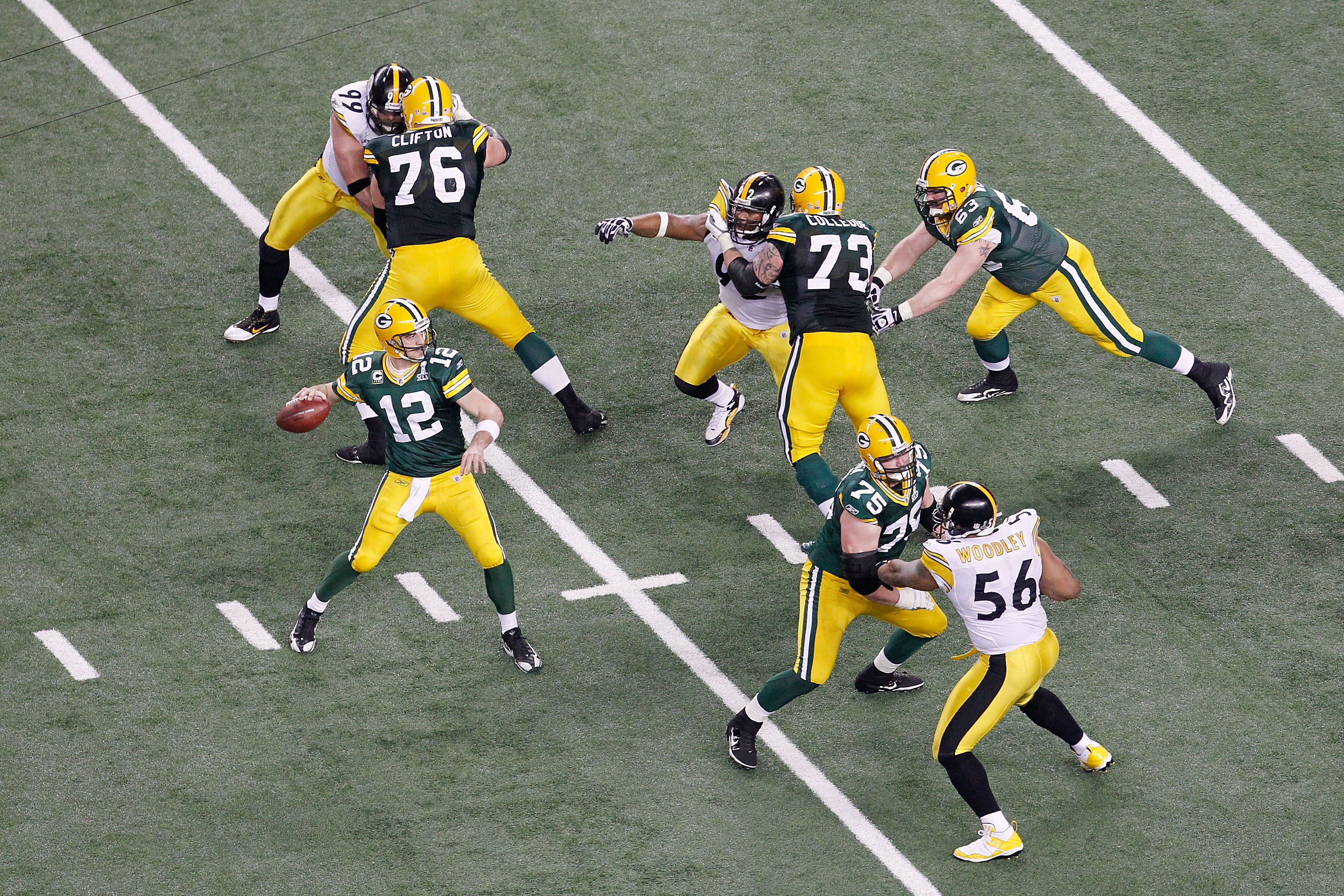 ARLINGTON, TX - FEBRUARY 06:  Aaron Rodgers #12 of the Green Bay Packers drops back to pass against the Pittsburgh Steelers during Super Bowl XLV at Cowboys Stadium on February 6, 2011 in Arlington, Texas.  (Photo by Tom Pennington/Getty Images)