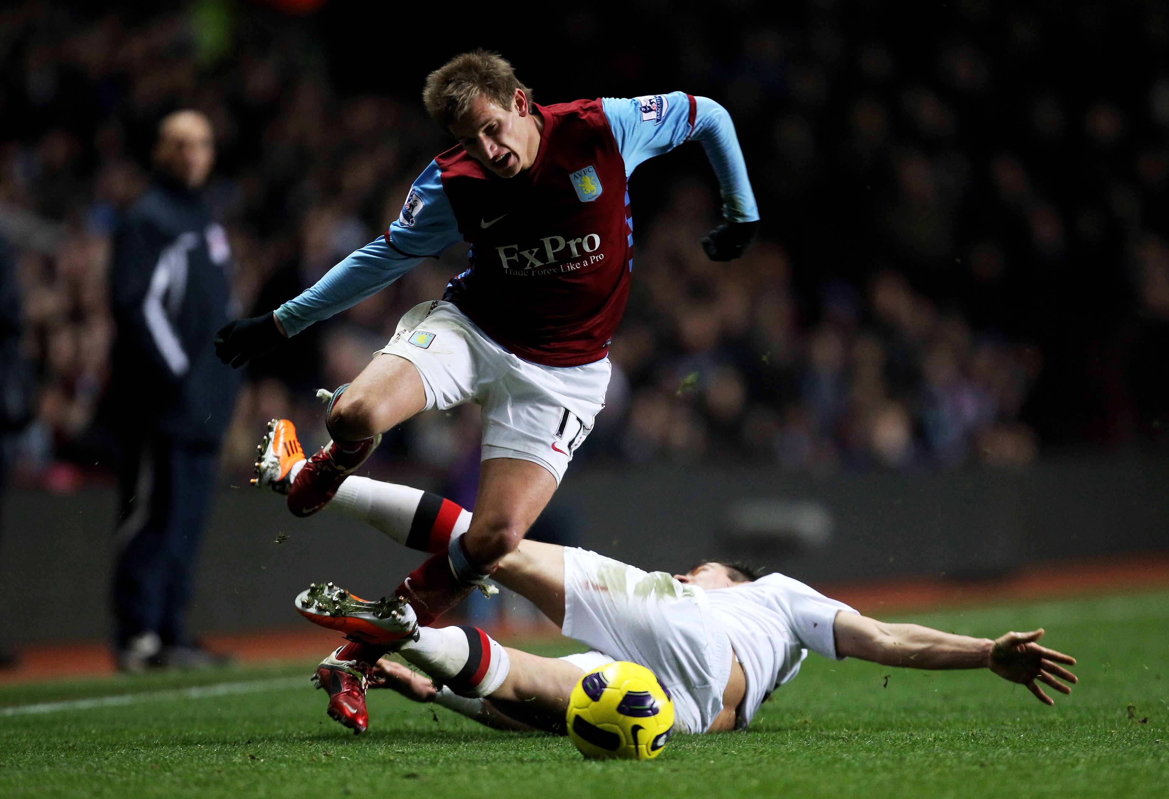 BIRMINGHAM, ENGLAND - JANUARY 22: Marc Albrighton of Aston Villa is brought down by Aleksandar Kolarov of Manchester City during the Barclays Premier League match between Aston Villa and Manchester City at Villa Park on January 22, 2011 in Birmingham, En BIRMINGHAM, ENGLAND - JANUARY 22: Marc Albrighton of Aston Villa is brought down by Aleksandar Kolarov of Manchester City during the Barclays Premier League match between Aston Villa and Manchester City at Villa Park on January 22, 2011 in Birmingham, En