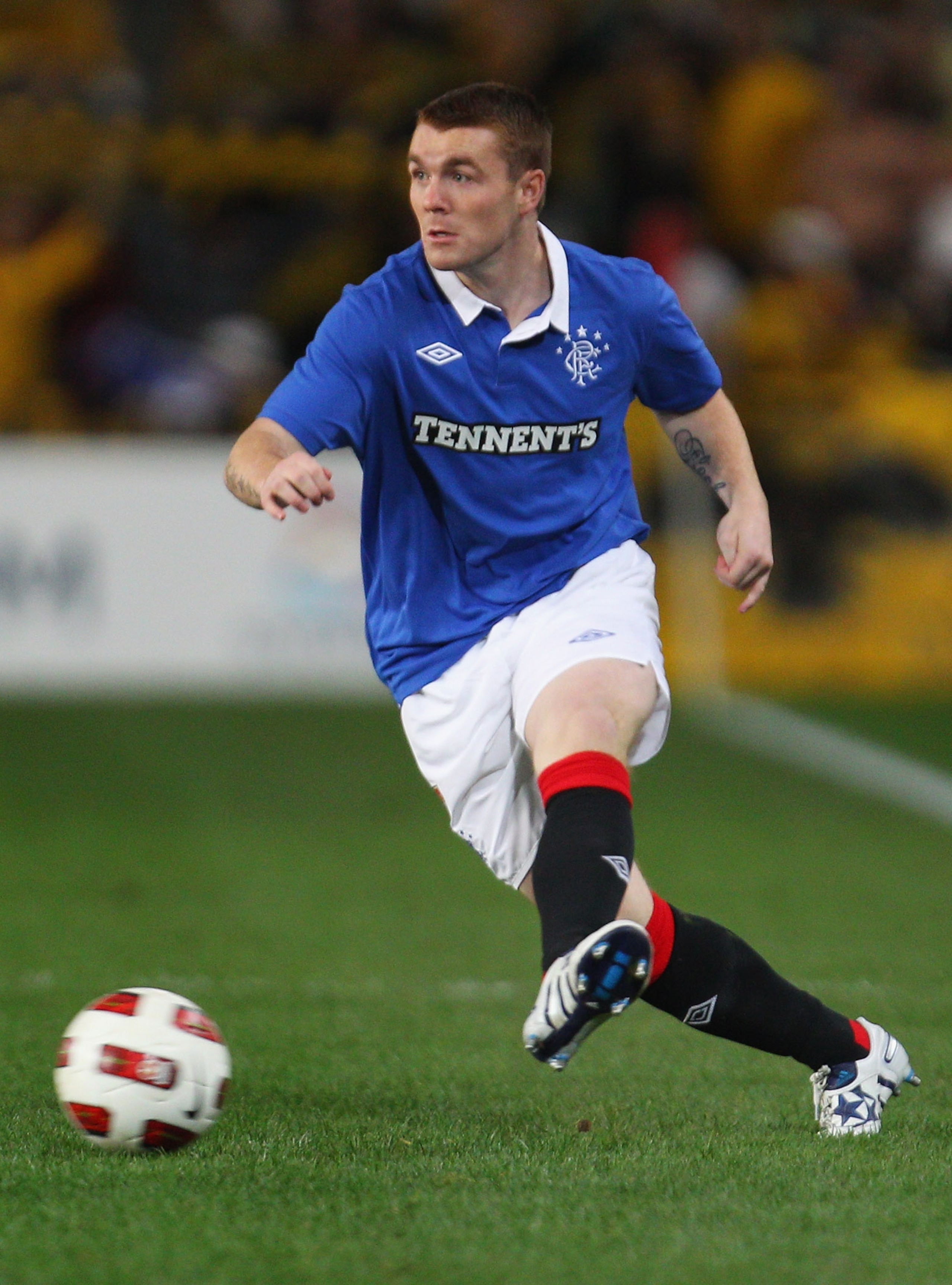 SYDNEY, AUSTRALIA - JULY 31:  John Fleck of Rangers passes the ball during the pre-season friendly match between AEK Athens FC and Glasgow Rangers at the Sydney Football Stadium on July 31, 2010 in Sydney, Australia.  (Photo by Mark Kolbe/Getty Images)