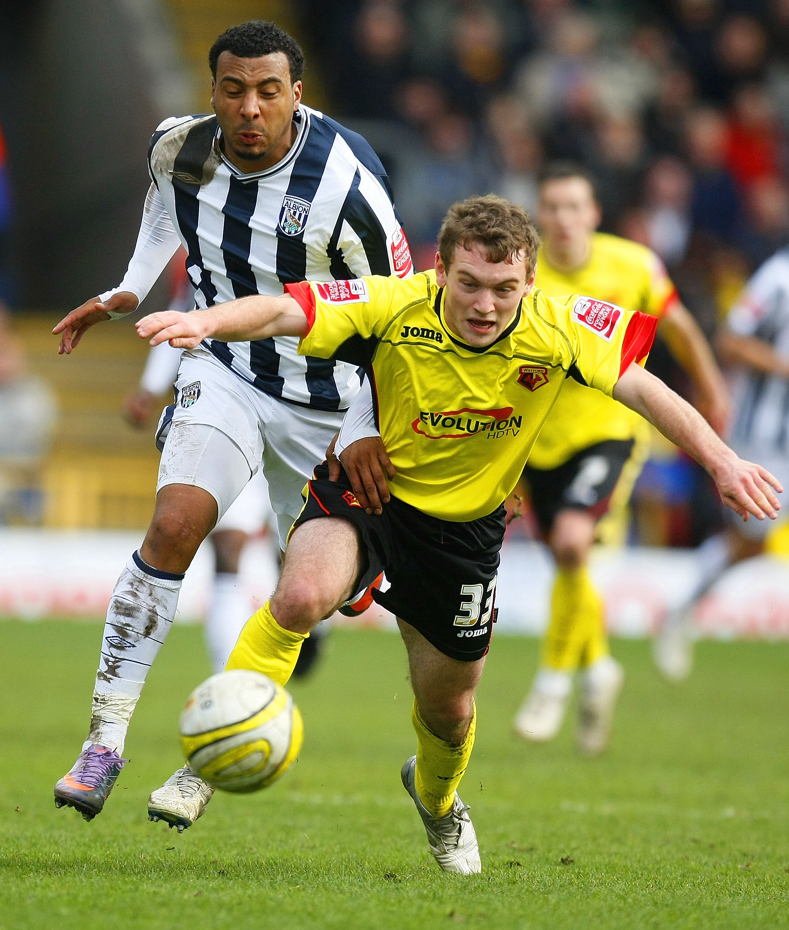 WATFORD, ENGLAND - APRIL 05:  Lee Hodson of Watford and Giles Barnes of West Bromwich Albion chase the ball during the Coca Cola Championship match between Watford and West Bromwich Albion at Vicarage Road on April 05, 2010 in Watford, England. (Photo by