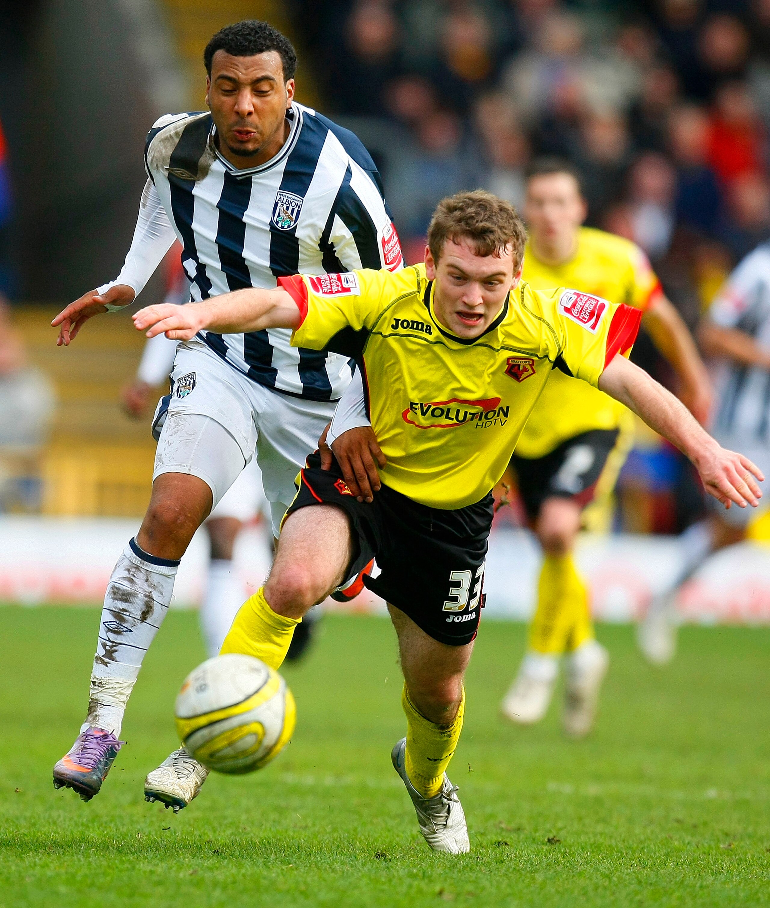 WATFORD, ENGLAND - APRIL 05:  Lee Hodson of Watford and Giles Barnes of West Bromwich Albion chase the ball during the Coca Cola Championship match between Watford and West Bromwich Albion at Vicarage Road on April 05, 2010 in Watford, England. (Photo by
