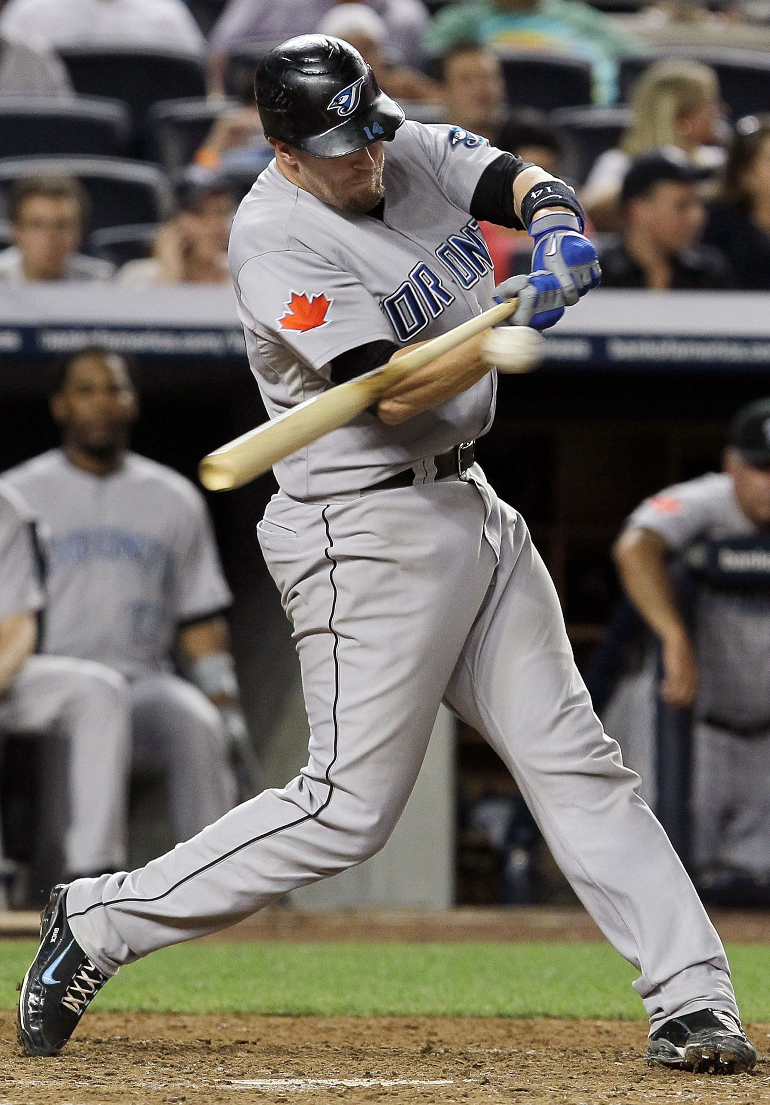 NEW YORK - AUGUST 03: John Buck #14 of the Toronto Blue Jays bats against of the New York Yankees on August 3, 2010 at Yankee Stadium in the Bronx borough of New York City. The Jays defeated the Yankees 8-2. (Photo by Jim McIsaac/Getty Images) NEW YORK - AUGUST 03: John Buck #14 of the Toronto Blue Jays bats against of the New York Yankees on August 3, 2010 at Yankee Stadium in the Bronx borough of New York City. The Jays defeated the Yankees 8-2. (Photo by Jim McIsaac/Getty Images)