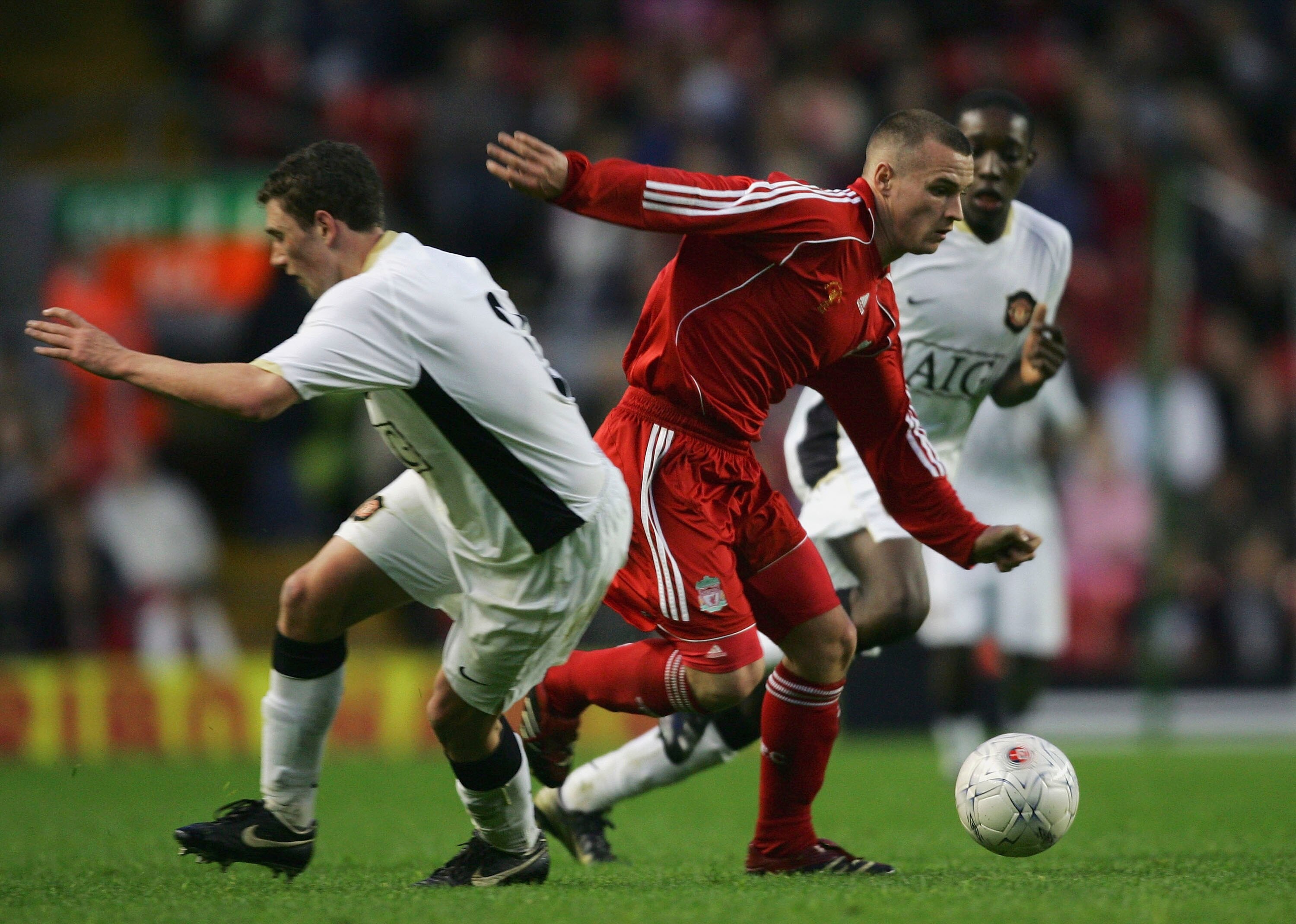 LIVERPOOL, UNITED KINGDOM - APRIL 16:  Jimmy Ryan of Liverpool beats Corry Evans of Manchester United during the FA Youth Cup Final 1st Leg match between Liverpool and Manchester United at Anfield on April 16, 2007 in Liverpool, England.  (Photo by Alex L