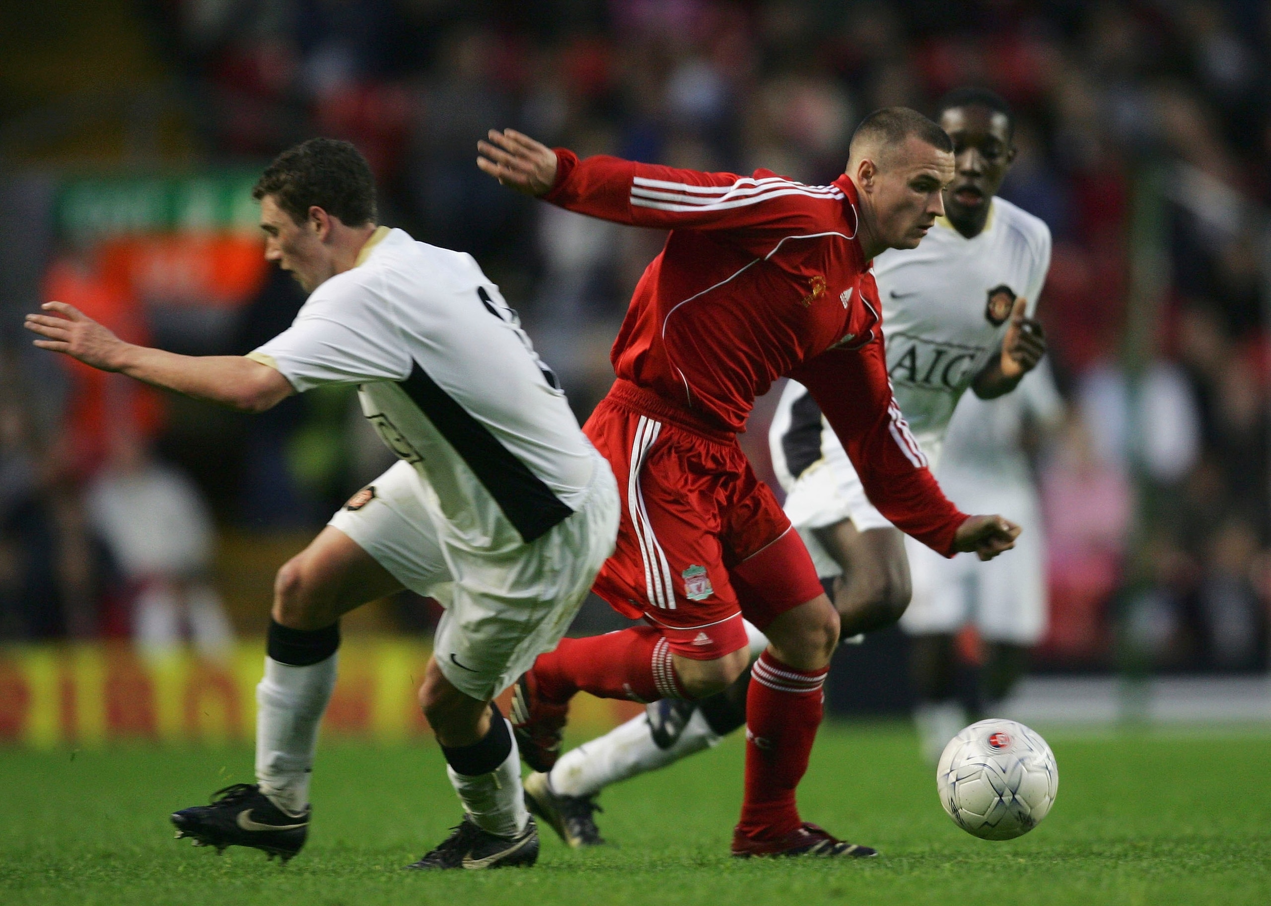 LIVERPOOL, UNITED KINGDOM - APRIL 16:  Jimmy Ryan of Liverpool beats Corry Evans of Manchester United during the FA Youth Cup Final 1st Leg match between Liverpool and Manchester United at Anfield on April 16, 2007 in Liverpool, England.  (Photo by Alex L