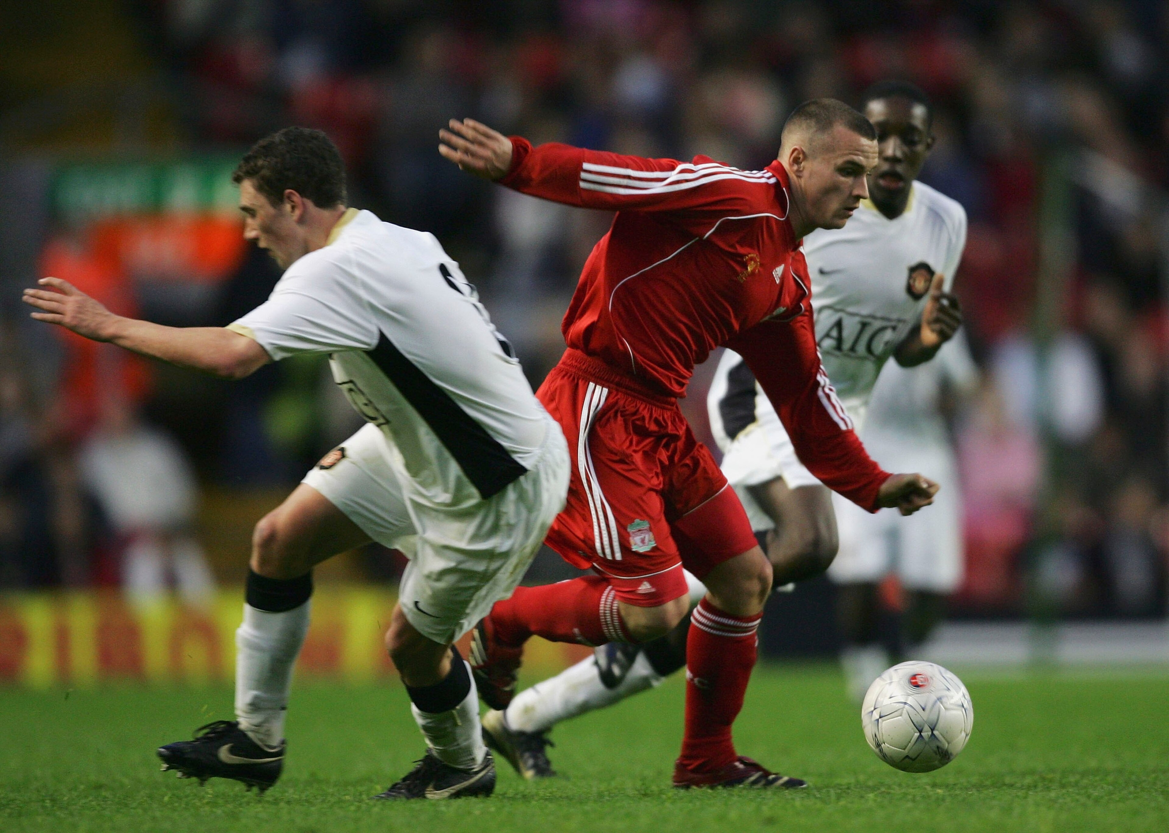 LIVERPOOL, UNITED KINGDOM - APRIL 16: Jimmy Ryan of Liverpool beats Corry Evans of Manchester United during the FA Youth Cup Final 1st Leg match between Liverpool and Manchester United at Anfield on April 16, 2007 in Liverpool, England. (Photo by Alex L LIVERPOOL, UNITED KINGDOM - APRIL 16: Jimmy Ryan of Liverpool beats Corry Evans of Manchester United during the FA Youth Cup Final 1st Leg match between Liverpool and Manchester United at Anfield on April 16, 2007 in Liverpool, England. (Photo by Alex L