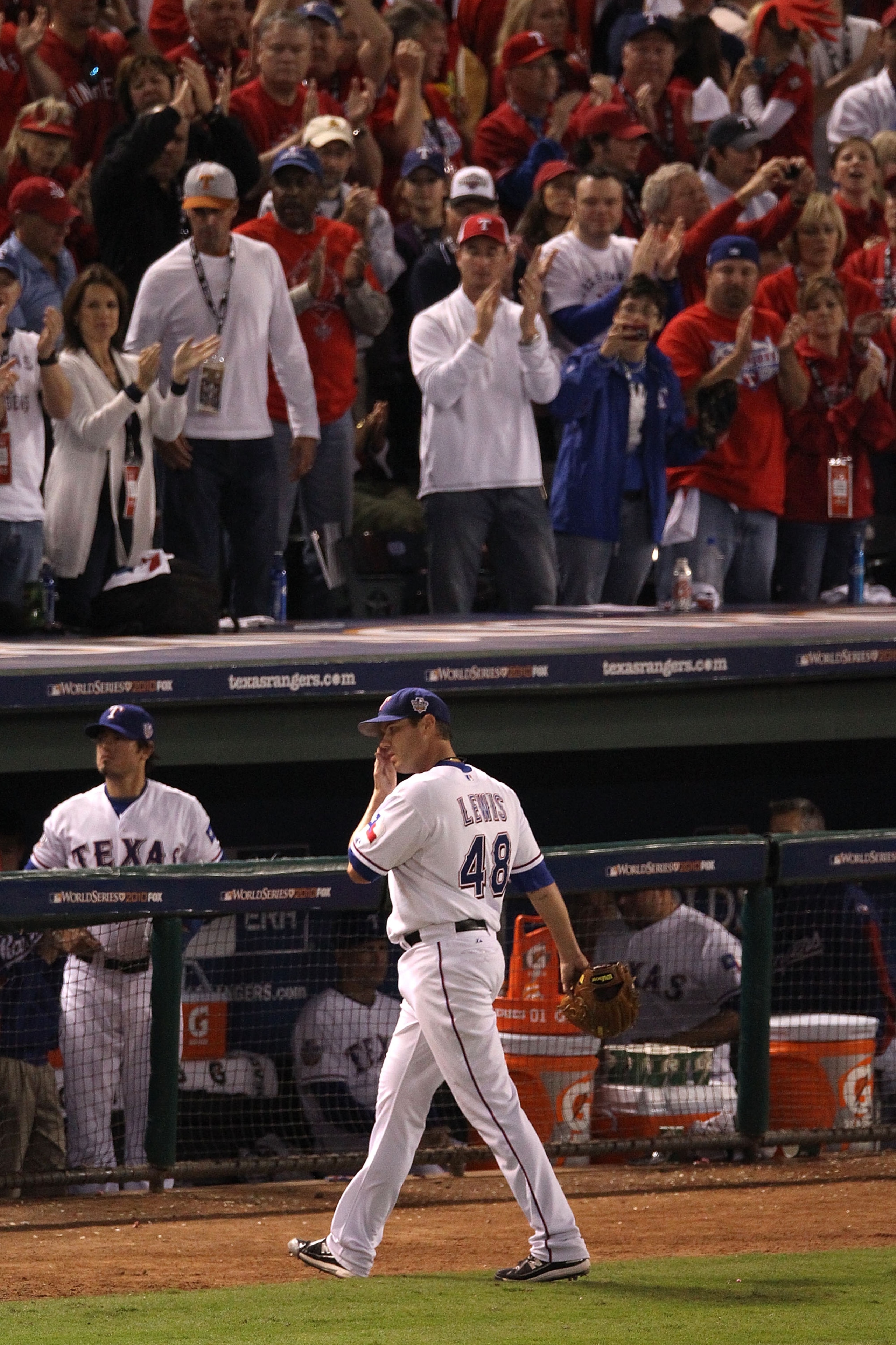 ARLINGTON, TX - OCTOBER 30: Colby Lewis #48 of the Texas Rangers walks to the dugout in the eigth inning against the San Francisco Giants in Game Three of the 2010 MLB World Series at Rangers Ballpark in Arlington on October 30, 2010 in Arlington, Texas. ARLINGTON, TX - OCTOBER 30: Colby Lewis #48 of the Texas Rangers walks to the dugout in the eigth inning against the San Francisco Giants in Game Three of the 2010 MLB World Series at Rangers Ballpark in Arlington on October 30, 2010 in Arlington, Texas.