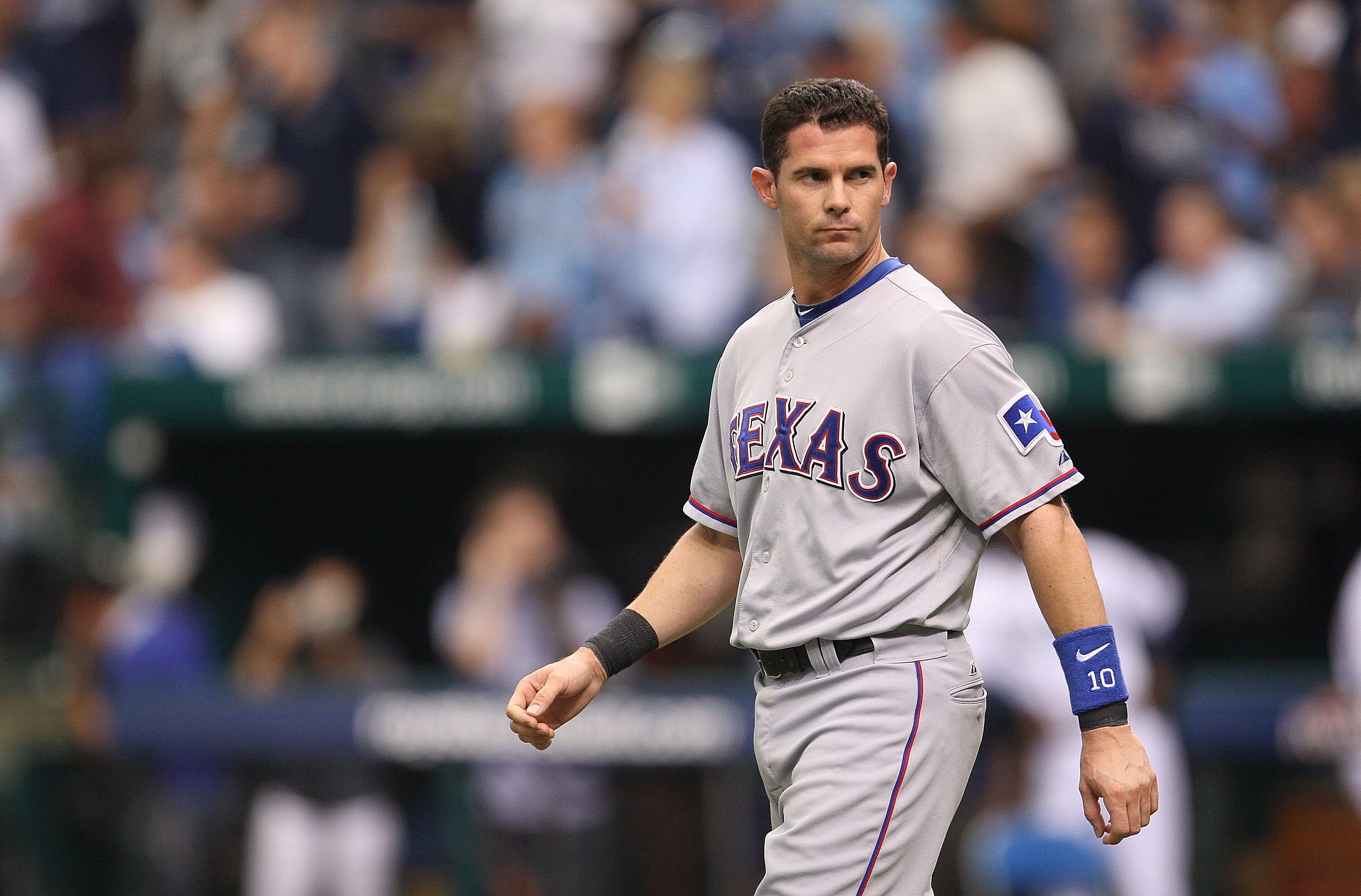 ST PETERSBURG, FL - OCTOBER 06:  6: Michael Young #10 of the Texas Rangers walks onto the field after striking out during Game 1 of the ALDS against the Tampa Bay Rays at Tropicana Field on October 6, 2010 in St. Petersburg, Florida.  (Photo by Mike Ehrma