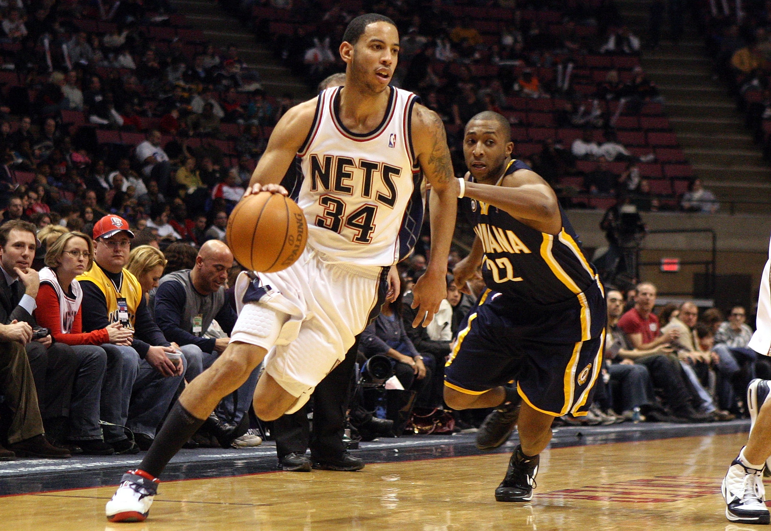 EAST RUTHERFORD, NJ - JANUARY 15: Devin Harris #34 of the New Jersey Nets drives past A.J. Price #22 of the Indiana Pacers at the Izod Center on January 15, 2010 in East Rutherford, New Jersey. NOTE TO USER: User expressly acknowledges and agrees that, b EAST RUTHERFORD, NJ - JANUARY 15: Devin Harris #34 of the New Jersey Nets drives past A.J. Price #22 of the Indiana Pacers at the Izod Center on January 15, 2010 in East Rutherford, New Jersey. NOTE TO USER: User expressly acknowledges and agrees that, b