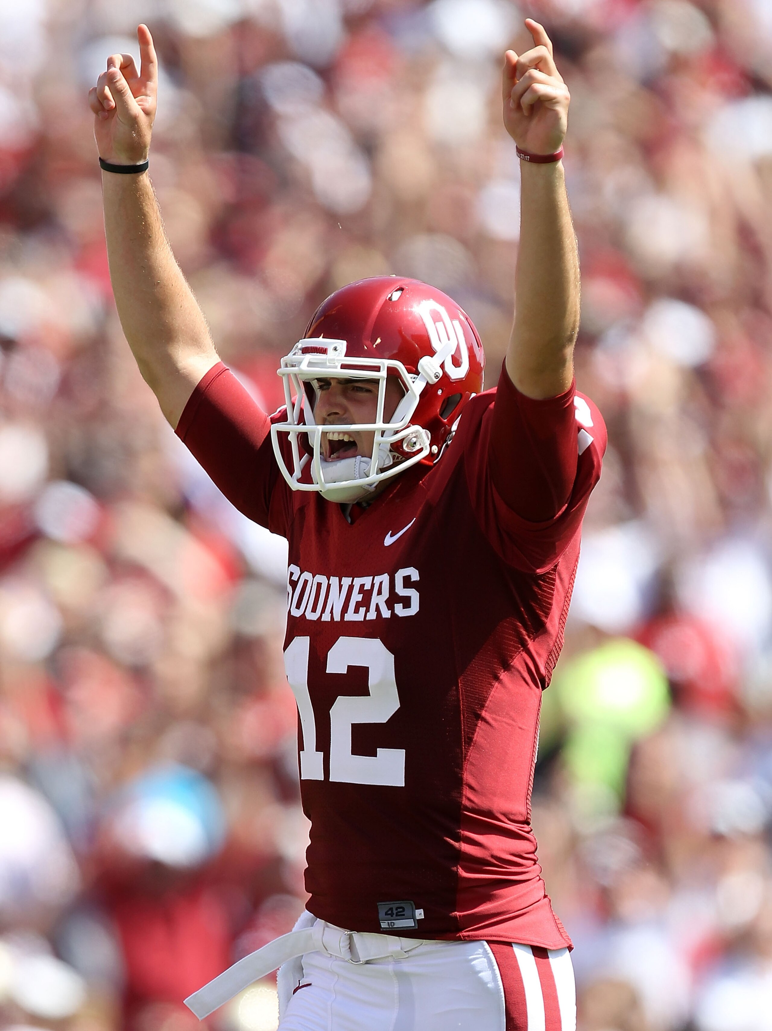 NORMAN, OK - SEPTEMBER 11: Quarterback Landry Jones #12 of the Oklahoma Sooners celebrates a touchdown against the Florida State Seminoles in the first quarter at Gaylord Family Oklahoma Memorial Stadium on September 11, 2010 in Norman, Oklahoma. (Photo NORMAN, OK - SEPTEMBER 11: Quarterback Landry Jones #12 of the Oklahoma Sooners celebrates a touchdown against the Florida State Seminoles in the first quarter at Gaylord Family Oklahoma Memorial Stadium on September 11, 2010 in Norman, Oklahoma. (Photo