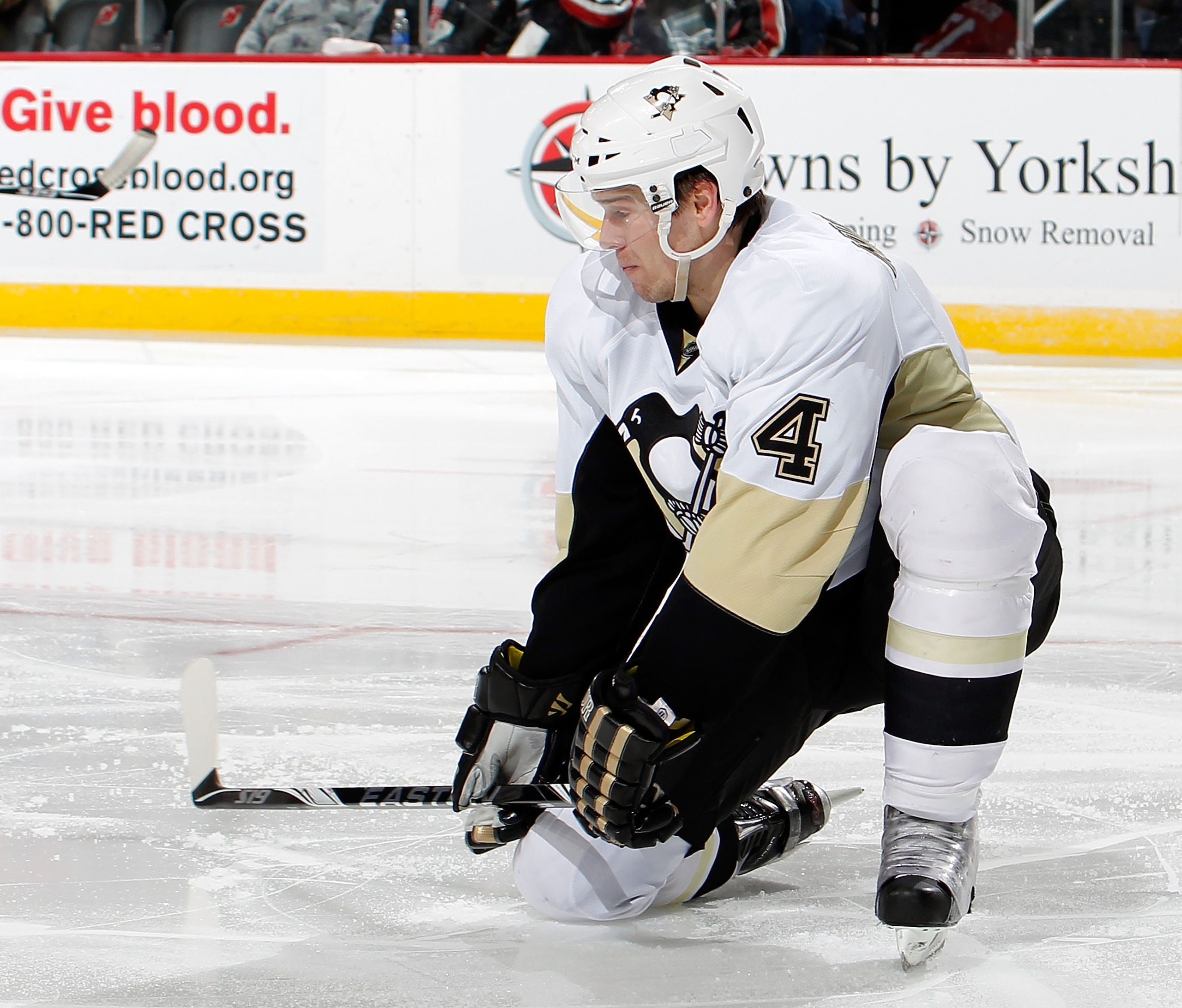 NEWARK, NJ - JANUARY 20:  Zbynek Michalek #4 of the Pittsburgh Penguins drops to his knee to block a shot in an NHL hockey game against the New Jersey Devils at the Prudential Center on January 20, 2011 in Newark, New Jersey.  (Photo by Paul Bereswill/Get