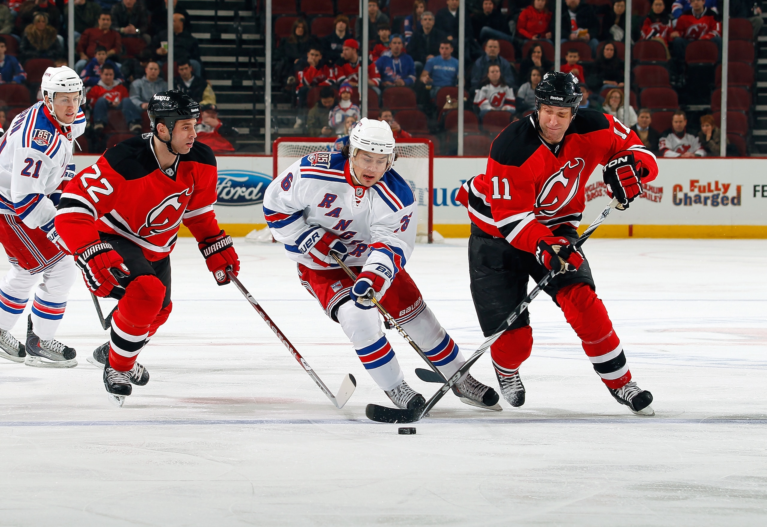 NEWARK, NJ - DECEMBER 29:  Mats Zuccarello #36 of the New York Rangers and Adam Mair #11 of the New Jersey Devils in action during a game on December 29, 2010 at the Prudential Center in Newark, New Jersey. The Rangers won 3-1.  (Photo by Lou Capozzola/Ge