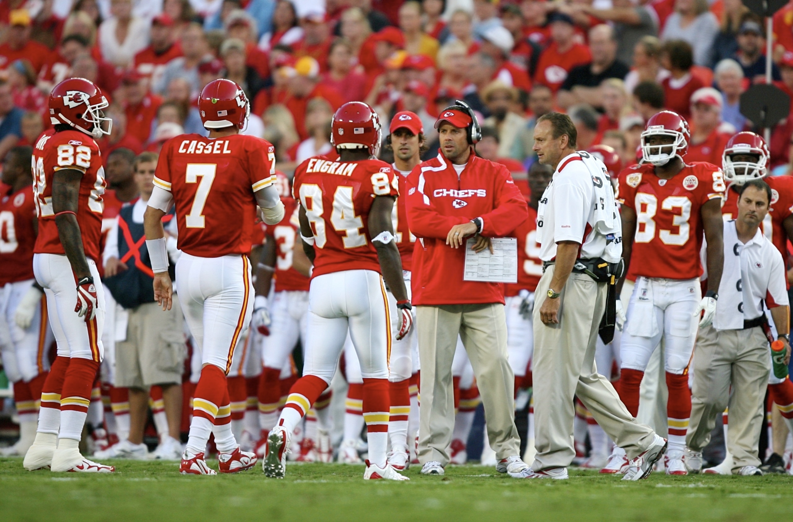 KANSAS CITY, MO - AUGUST 29: Quaterback Matt Cassel #7 of the Kansas City Chiefs walks with teammates Dwayne Bowe #82 and Bobby Engram #84 to the sidelines towards head coach Todd Haley (C)  after Cassell appeared to hurt his left leg against the Seattle