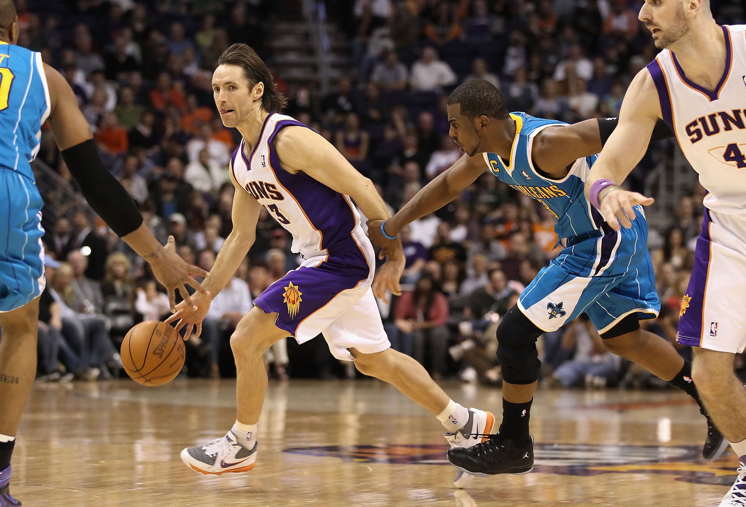 PHOENIX, AZ - JANUARY 30:  Steve Nash #13 of the Phoenix Suns handles the ball during the NBA game against the New Orleans Hornets at US Airways Center on January 30, 2011 in Phoenix, Arizona.  The Suns defeated the Hornets 104-102. NOTE TO USER: User exp