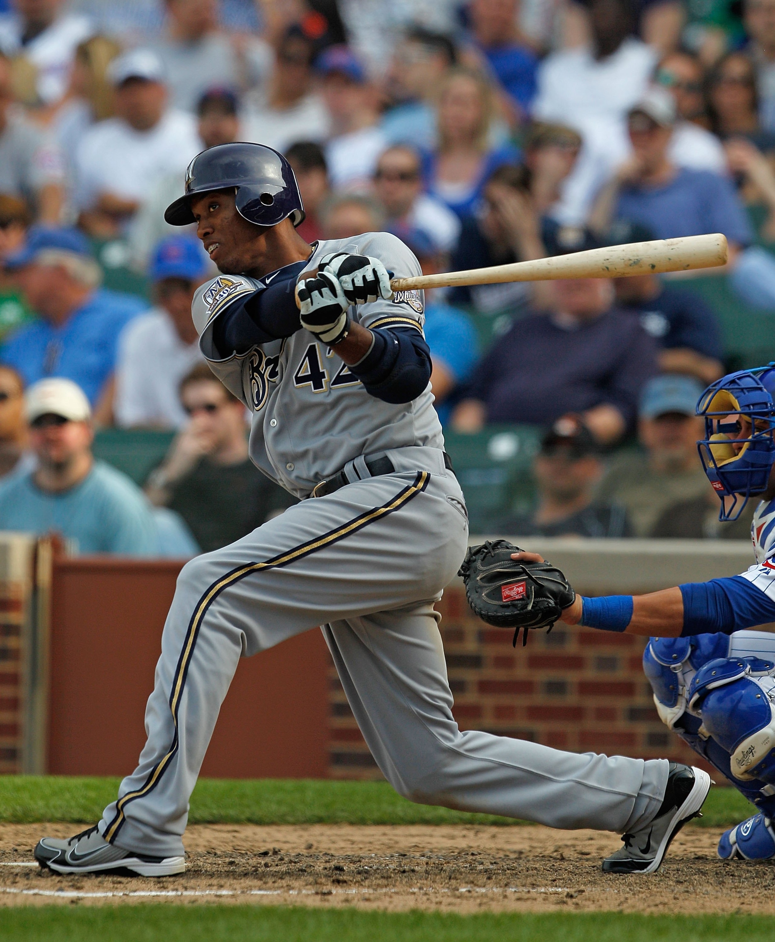 CHICAGO - APRIL 15: Alcides Escobar of the Milwaukee Brewers, wearing a nmber 42 jersey in honor of Jackie Robinson, hits the ball against the Chicago Cubs at Wrigley Field on April 15, 2010 in Chicago, Illinois. The Brewers defeated the Cubs 8-6.  (Photo