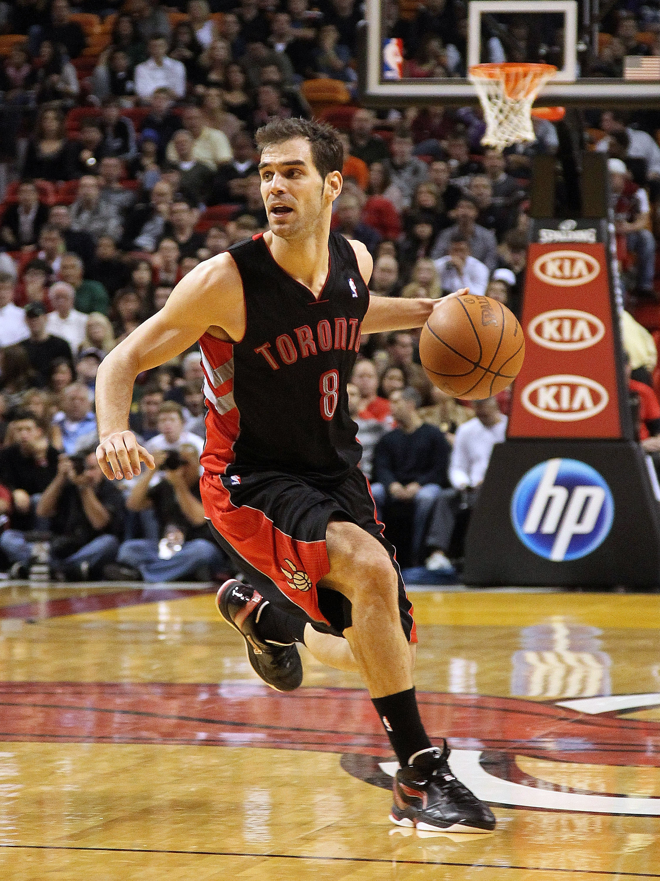 MIAMI, FL - JANUARY 22:  Jose Calderon #8 of the Toronto Raptors dribbles the ball during a game against the Miami Heat at American Airlines Arena on January 22, 2011 in Miami, Florida. NOTE TO USER: User expressly acknowledges and agrees that, by downloa