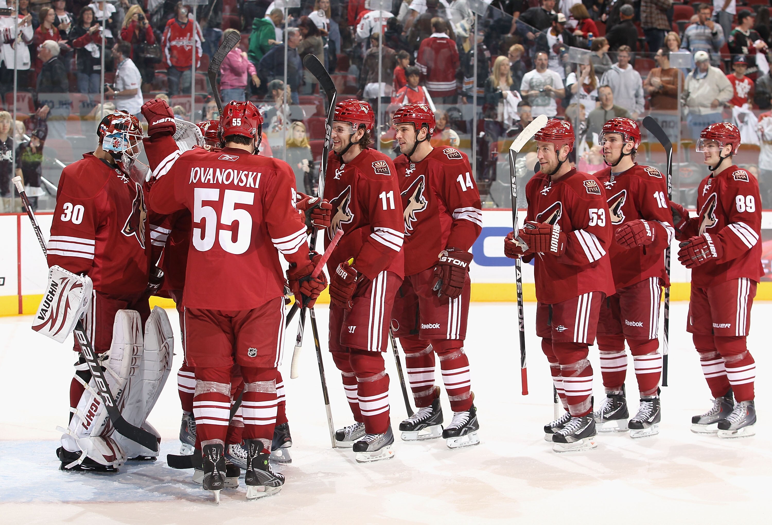GLENDALE, AZ - FEBRUARY 14:  Goaltender Ilya Bryzgalov #30 of the Phoenix Coyotes celebrates with teammates after defeating the Washington Capitals in the NHL game at Jobing.com Arena on February 14, 2011 in Glendale, Arizona. The Coyotes defeated the Cap