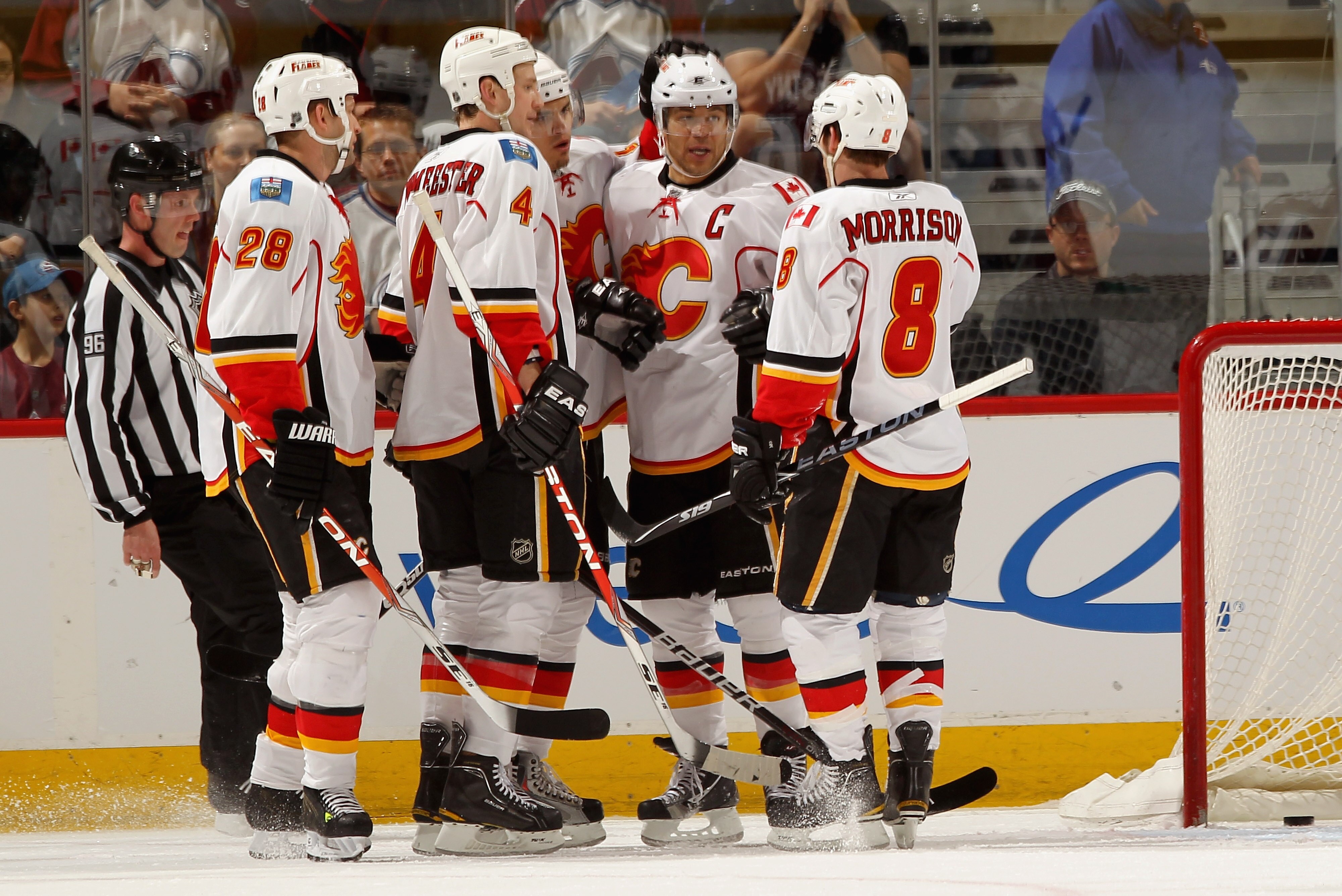 DENVER, CO - FEBRUARY 14:  (L-R) Robyn Regehr #28, Jay Bouwmeester #4, Rene Bourque #17, Jerome Iginla #12 and Brendan Morrison #8 of the Calgary Flames celebrate Iginla's first period goal to give the Flames a 3-0 lead over the Colorado Avalanche at the