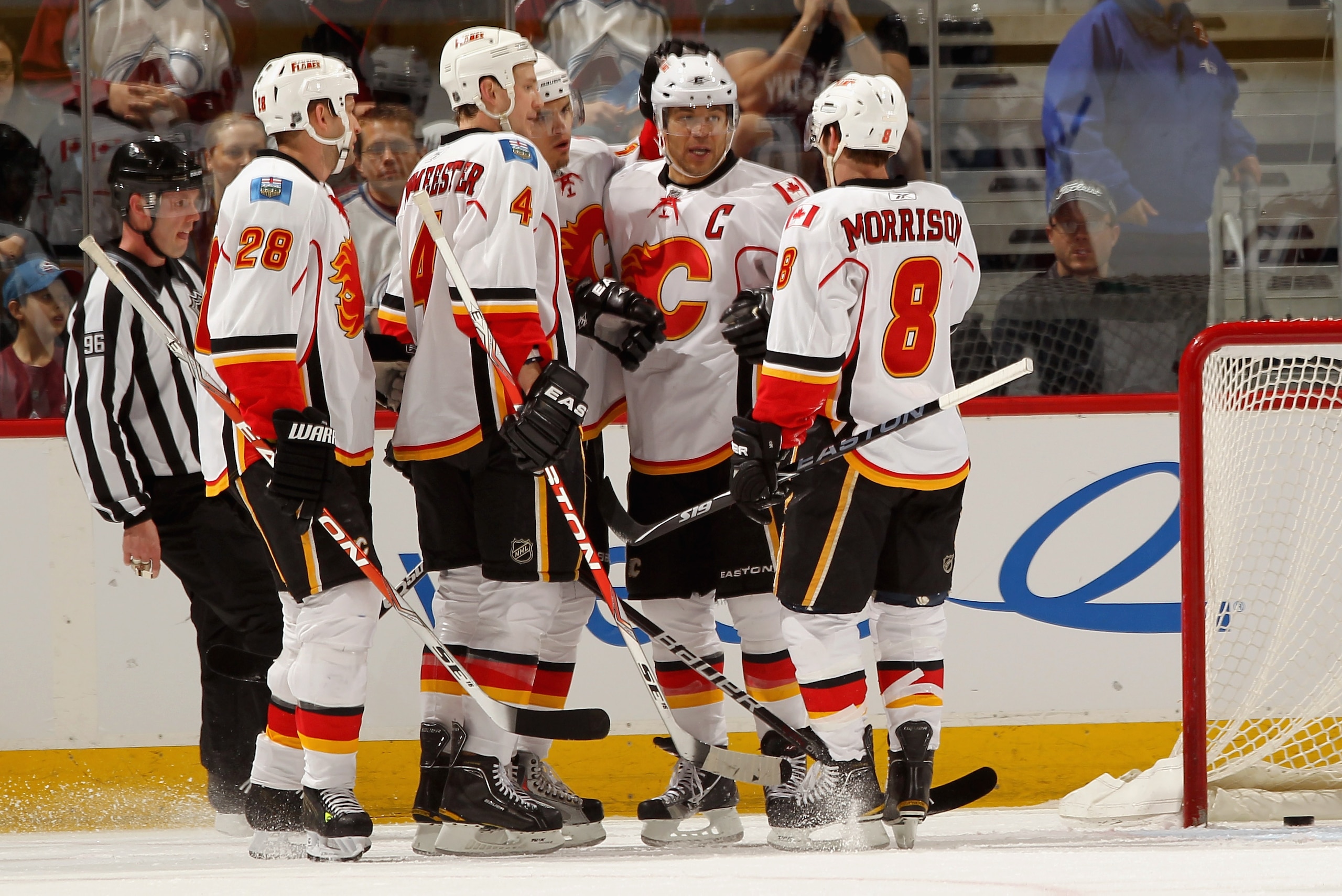 DENVER, CO - FEBRUARY 14: (L-R) Robyn Regehr #28, Jay Bouwmeester #4, Rene Bourque #17, Jerome Iginla #12 and Brendan Morrison #8 of the Calgary Flames celebrate Iginla's first period goal to give the Flames a 3-0 lead over the Colorado Avalanche at the DENVER, CO - FEBRUARY 14: (L-R) Robyn Regehr #28, Jay Bouwmeester #4, Rene Bourque #17, Jerome Iginla #12 and Brendan Morrison #8 of the Calgary Flames celebrate Iginla's first period goal to give the Flames a 3-0 lead over the Colorado Avalanche at the