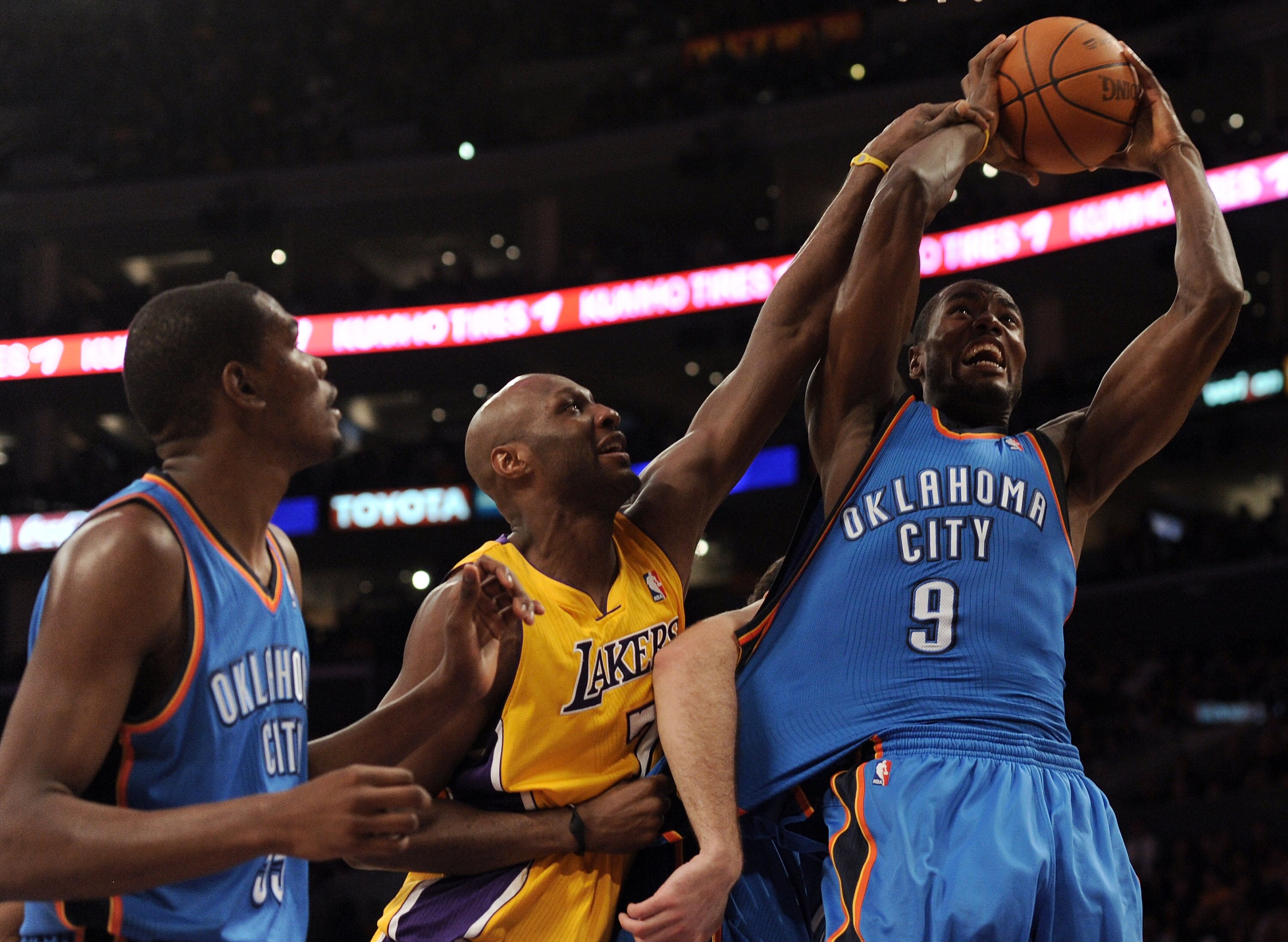 LOS ANGELES, CA - JANUARY 17:  Lamar Odom #7 of the Los Angeles Lakers is called for a foul on Serge Ibaka #9 of the Oklahoma City Thunder as Kevin Durant looks on during a 101-94 Laker win at the Staples Center on January 17, 2011 in Los Angeles, Califor